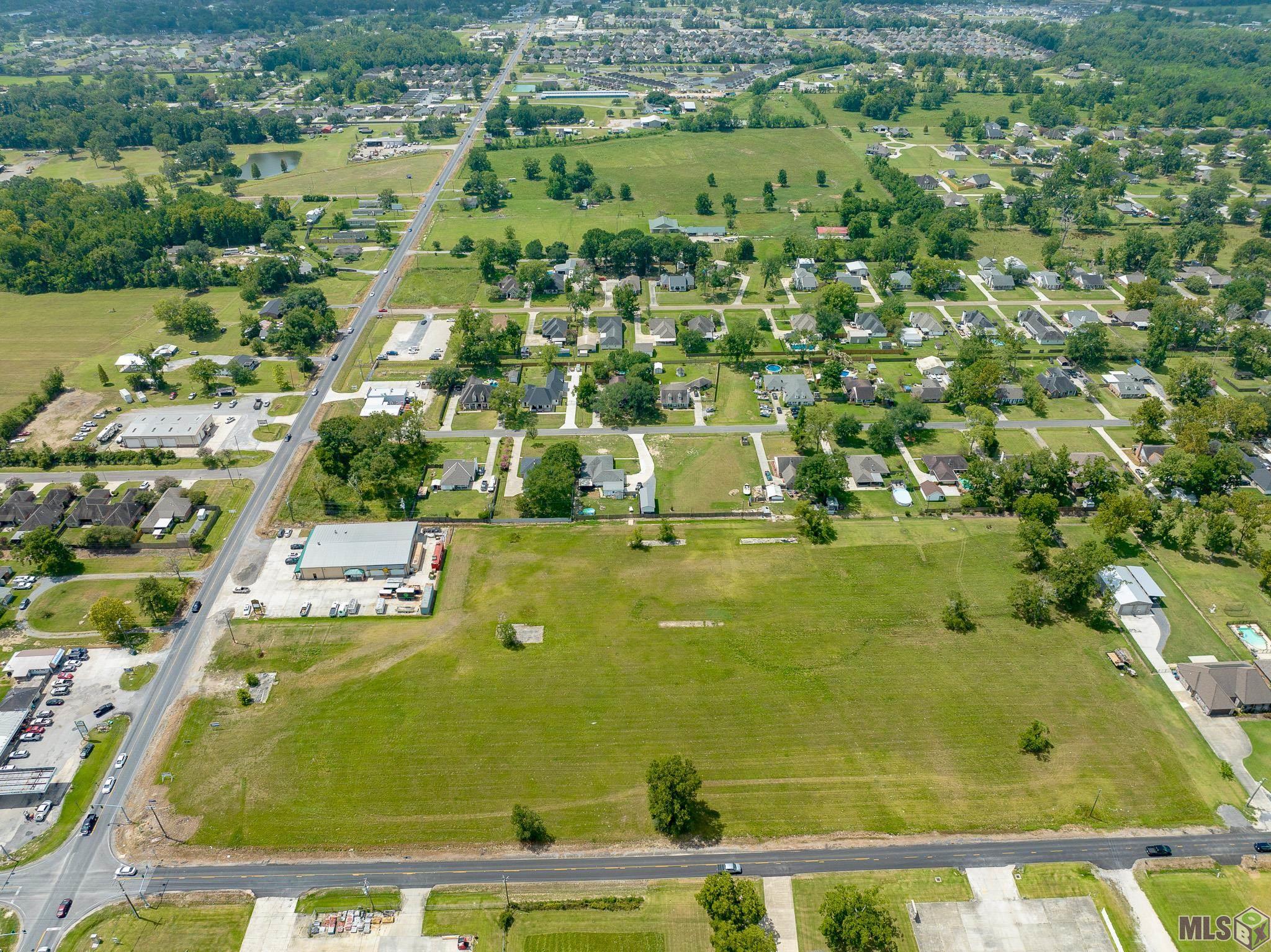 COMMERCIAL LAND FOR SALE! Hard corner, cleared lot, prime location. Intersection of Hwy 44 & Causey Rd in Gonzales.   Excellent Visibility!!