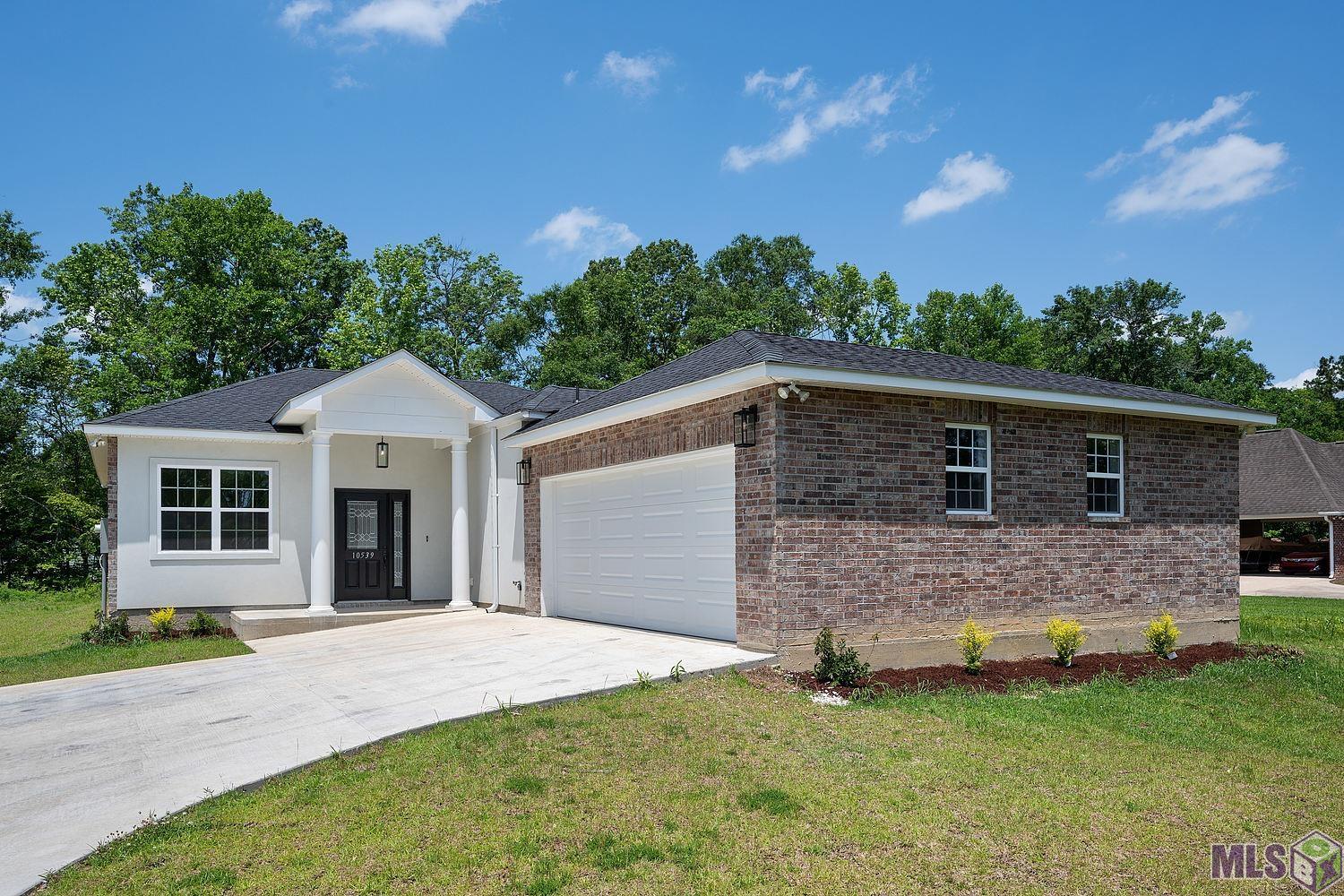 This 3 bedroom, 2.5 bath home in the Northwoods subdivision in Greenwell Springs is absolutely stunning! FLOOD ZONE X- does not require flood insurance. Preferred Lender will contribute up to $1000 credit to buyer! This new construction home features 10’ ceilings with an open floor layout. It was built with a great attention to quality and detail. This house includes vinyl flooring throughout the main areas as well as the master bedroom and porcelain tiles in the bathrooms. Kitchen features white Quartz countertops and kitchen island, white cabinets, and gas cooktop. Master bathroom will feature a double vanity, jetted tub, and a separate walk-in shower. Central air and heating, which includes gas heating. The spacious living area is perfect for entertaining guests, an office for working from home, and a formal dining room for all family meals. A large 2 car garage will lead you to a mud room great for extra storage. This home has so more to offer. Don't miss your chance to see for yourself!