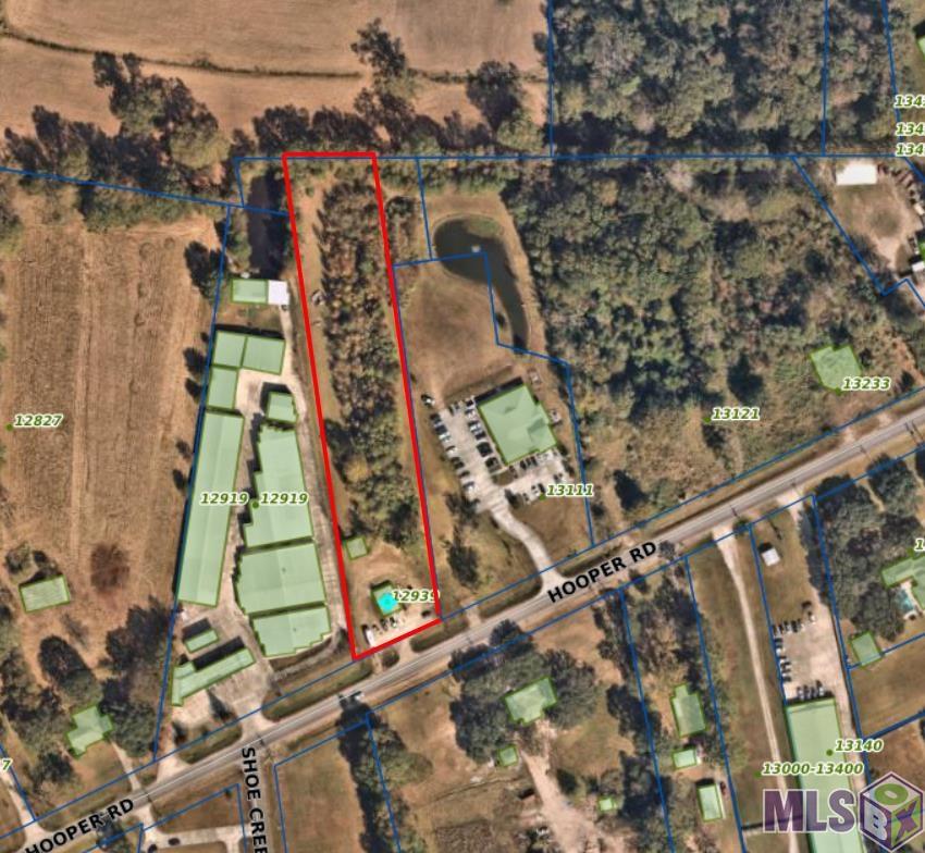 This offering is approximately 2.55 acres (111,342 sf) that sits on Hooper Road rignt in the middle of the fast growing city of Central, north of Baton Rouge. Fronting Hooper Road at about 150 feet, with a depth of approximately 715 feet. This property has a small utility building being used as an automotive inspection station at the moment. It is flanked by Central Physical Therapy to the East and AA2 Mini Storage to the West.
