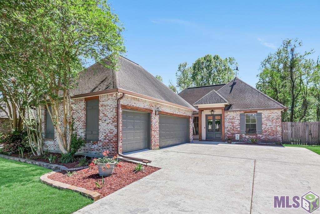 Come see this CUSTOM BUILT 3 bedroom home in the private, gated community of Gates at Windsong. As you enter you notice the exposed cypress beams and plenty of natural light with the wall of windows and open floorplan. The living room has a gas fireplace with custom tile surround, built-in book shelves and french doors that lead to the extended patio. The living room connects with the updated dining area and features bar seating. The kitchen has stainless appliances, gas stove, an island for extra food prep, built-in microwave, plenty of cabinets and pantry. The master bedroom is located off the living room at the back of the home and easily accommodates a king size bed, features 2 walk-in closets, plus an en-suite bath with soaking tub, walk-in shower, dual vanities and separate water closet. Off the front hallway you will find 2 bedrooms, a full bathroom, plus an additional linen closet. The laundry room is located off the kitchen and has plenty of space for an extra fridge/freezer, plus a built-in desk, extra storage and can easily function as a mud room. The fully fenced backyard is great for entertaining with a large patio and is very private with no back neighbors plus has extra storage space off the back of the home. Additional features include, gutters, professional landscaping, 2 car garage and golf cart/mower garage. BUT WAIT THERE'S MORE.....  this home qualifies for an amazing loan program that offers 100% financing with *NO PMI * and at a special reduced interest rate - make sure to ask about this product to save you money! Home is located in flood zone X.