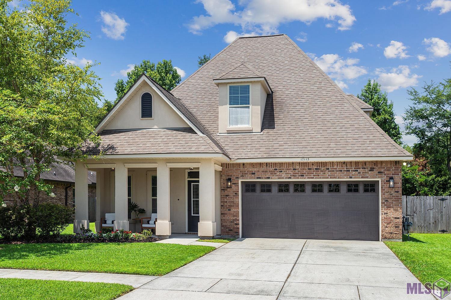 If a SPACIOUS home in a HIGHLY sought-after Subdivision is what you have been looking for then this BULLION CROSSING beautiful 4 bedroom 3 full bath home will charm you from the moment you arrive! As you drive up, you will notice the beautiful 2-story facade, front porch, landscaped yard, and generously sized 2-car garage. You will love the well-laid-out open floor plan with 2 bedrooms and 2 full baths downstairs and 2 more generously sized bedrooms and a full bath upstairs. This well-maintained home includes gutters, blinds, and 3 built-in desks, has an abundance of storage, large closets, ample cabinets, and built-ins!!  The chef-style kitchen offers stainless-steel appliances, a gas stove, granite countertops, an Island with bar top seating with room for up to 4 stools, and an ENORMOUS walk-in PANTRY!!  You will enjoy the cozy living room with lots of natural light, hand-scraped wood flooring, and an adjoining dining area that sits between the den and the kitchen. Directly off the kitchen is a covered patio that is pre-wired for an outdoor TV.  You will enjoy lots of time in your backyard with a wooden privacy fence and circular bricked area for seating around the fire pit! This home is wide open for entertaining both inside and out!  The well-manicured neighborhood has sidewalks, parks, and a walking path and is conveniently located in the heart of Prairieville, near shopping and restaurants. This home requires NO FLOOD insurance.  Seller will contribute $5,000 towards carpet allowance or closing costs.