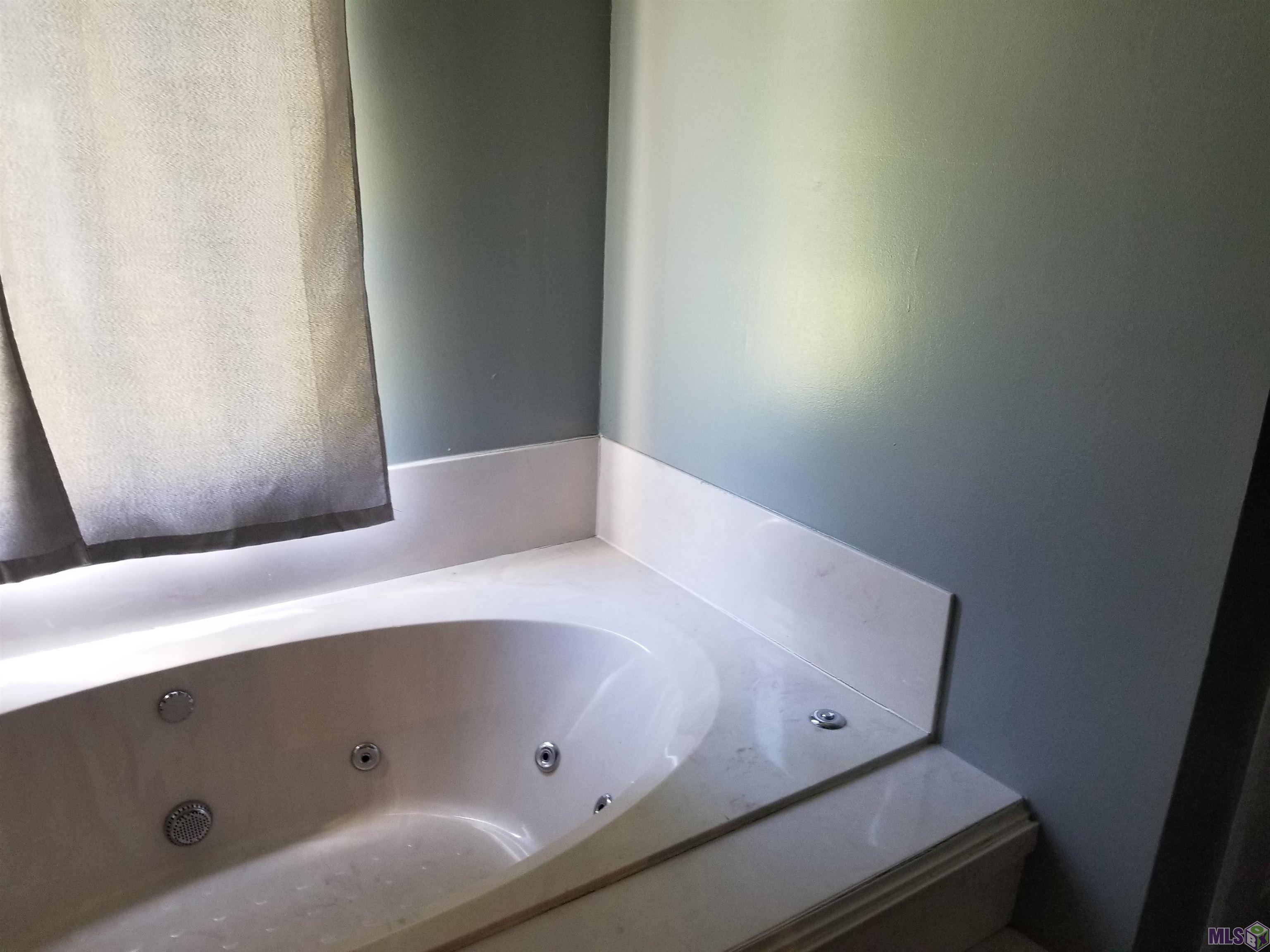 Updated with a soothing color palette. Separate shower  double vanities and a water closet.