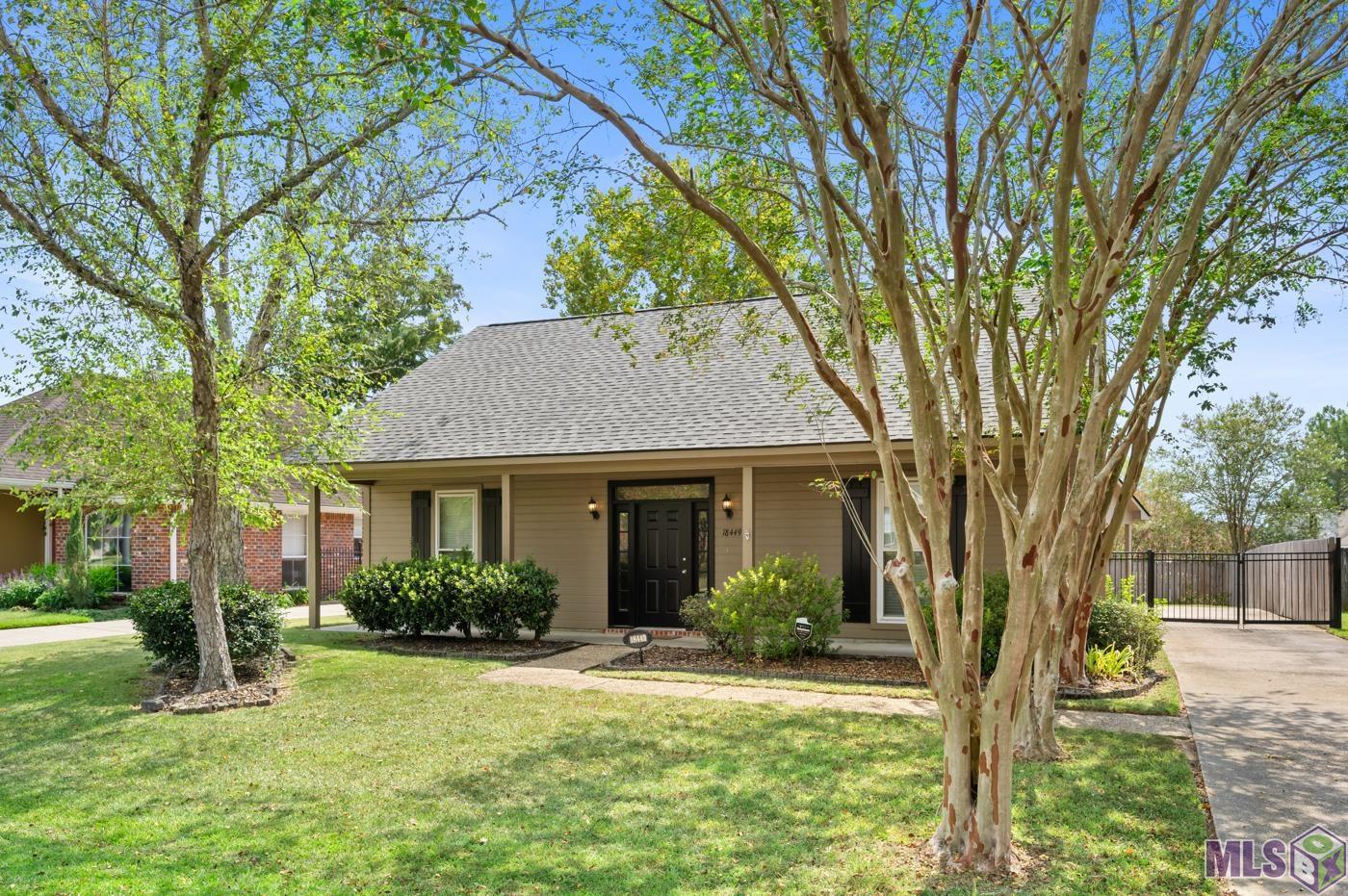 This well-maintained 3-bedroom home is located on a quiet street in the popular Azalea Lakes Subdivision in Baton Rouge. The spacious living room features beautiful laminate wood flooring, a wood-burning fireplace, crown molding, and a bright interior. The kitchen offers wood-stained cabinetry with an abundance of storage space, tile countertops and backsplash, an electric cooktop, brick paver flooring, and a breakfast bar. The bedrooms are all spacious with ample amount of closet storage. The master bath features a large soaking tub, double vanities, and two walk-in closets. Hall bathroom updated in 2021 with large walk-in shower and widened doorway for handicap access. You will love your evenings outdoors, on the open patio with views of your private, wood-fenced backyard. There is a wrought iron gate across the driveway for extra privacy. There is a 2-car rear carport with a storage room, plus an 8x8 tuff shed that will remain with the home. The roof was replaced in 2021, wood fence installed 2021 and exterior HVAC was replaced in 2018. Windows replaced in 2011 with a transferable life time warranty! FLOOD ZONE X, no flood insurance required! Call for your private showing today.