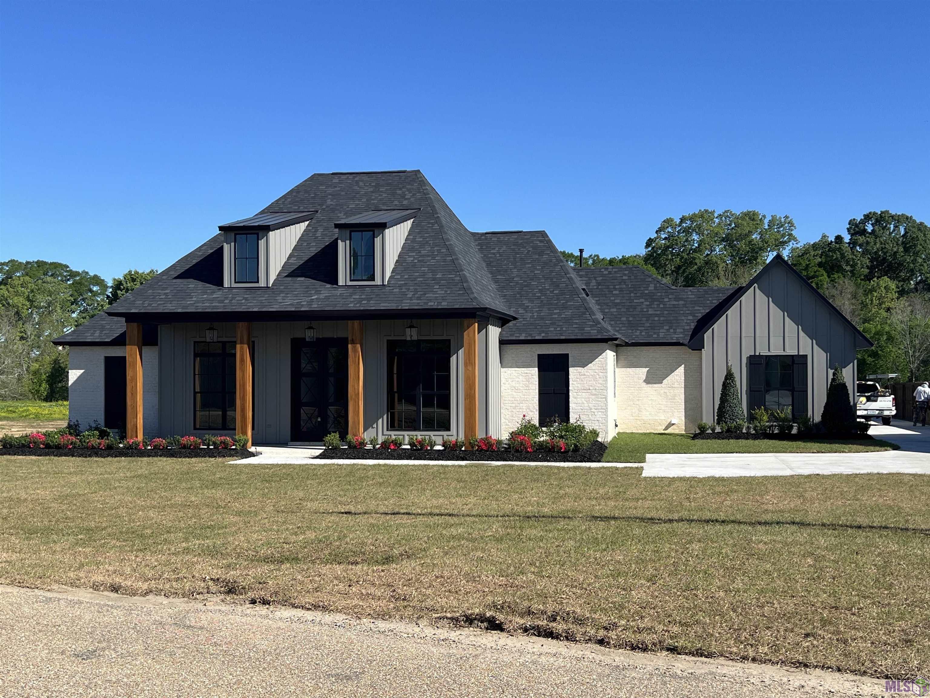 Absolutely Stunning New Home by Award-Winning Waguespack Homes, that will be Featured in the 2024 Parade of Homes! Sitting on over an acre lot, this Bayou Manchac Frontage home has it all! 4 BR, 3 BA, with a Study AND a Game Room / Entertainment Area - ALL ON ONE FLOOR! Spectacular Views of the Huge Lot and Bayou Manchac await you and your guests from the Living Area AND the Extra Large Rear Porch! Rear Porch includes a Retractable Screen, Fireplace, and Outdoor Kitchen, with Large French Doors that lead back into the Game Room - Absolutely Wonderful Space for entertaining family and friends! The Garage has room for 3 vehicles, with the main 2 car garage also opening up into the rear yard area - Great for those crawfish boils or outdoor gatherings! The Kitchen is Beautifully appointed, with a hidden pantry built into the cabinets, and a large island with seating options on 3 sides. The Master Bath is Beautiful, with expertly selected finishes and an oversized soaking tub with separate shower. Exquisite details are EVERYWHERE in this home! It's definitely a Show Stopper that should be well received in this year's Parade of Homes. Available for Purchase now, but home must be allowed to be viewed in this year's Parade of Homes at the end of April. Call Owner/Broker for more details.