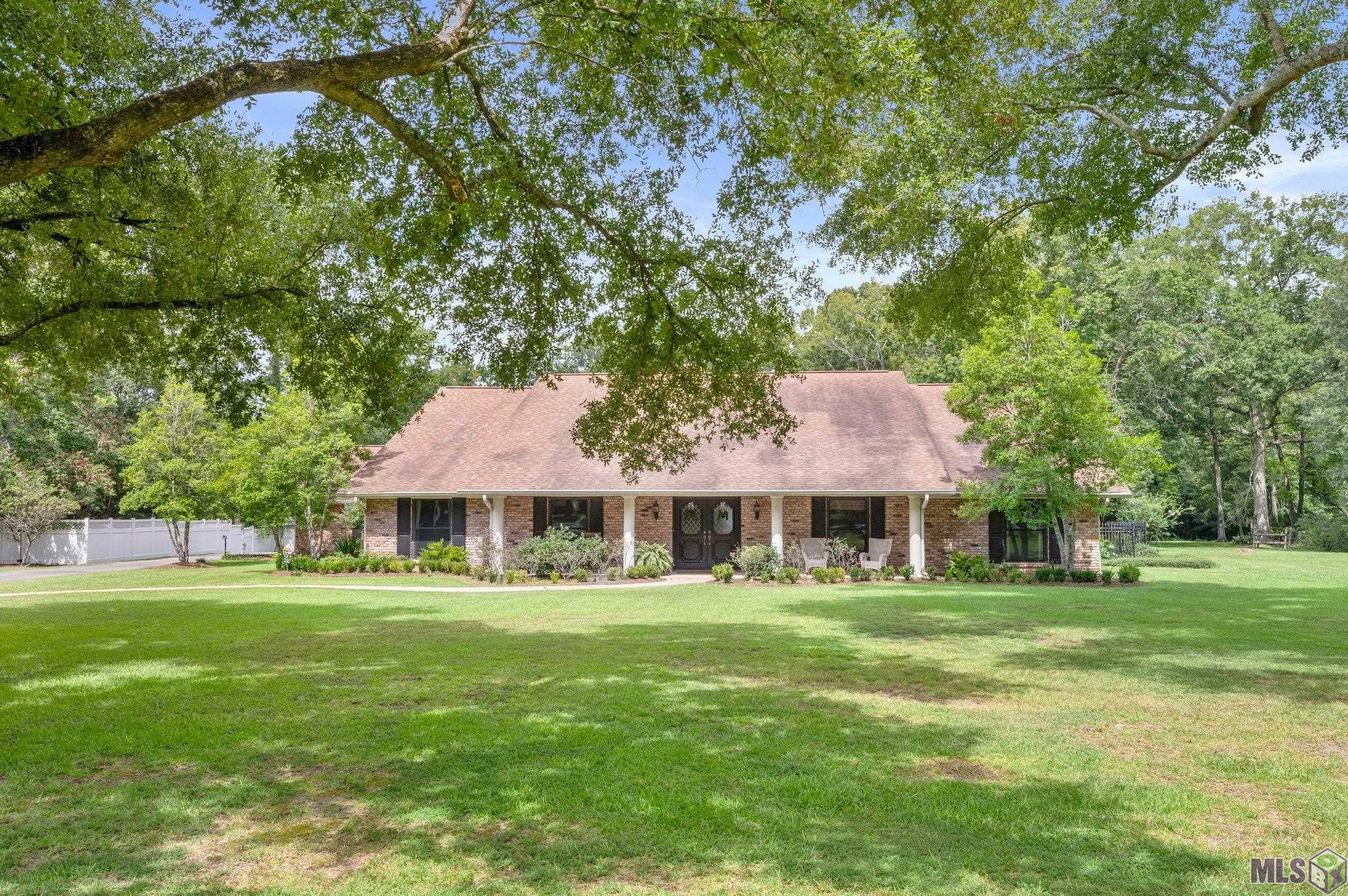 As you walk through the pictures let me narrate. You drive up to a handsome home on appx 3 acres. Double front doors open into large Foyer looking through to a "Ball" size family room with a wood burning fireplace and French doors on each side lead out to a bit piece of paradise. From the Foyer to the left is very large living & dining area. Loads of large pane Pella Windows throughout the home and come with a lifetime warranty. Now step into the Kitchen and there will be slabs of quartz running on each side. A six burner Dacor range, all top of line appliances, chef series. Also a wet bar with ice maker so you can serve your guest in family room. Peek out and see the beautiful views but before going out let's see more of the home. Down a marble floor hallway will be one of the 3 full baths, there is a half bath off kitchen for guest. Next large bedroom currently being used as an office. Next another large and lovely bedroom sharing a jack & Jill with next bedroom. This Bath has gorgeous marble counters  2 sinks and freshly tilled bath area. Back in hall on left is enormous storage closet. It shares a wall with primary bath so the possibilities or endless. Primary bedroom looks out to the property. Bath has marble counters and shower, a closet on each side for his & hers. Now that you are going outside to quiet and peace. There is a Pool with a new liner, a "pool" house with its own bath. Don't miss out on Barn w/ tons of storage in different areas Just as you leave you will see the charming old sinks feeling the old & new really can go together. The Whole House Generator and no flood insurance makes this an opportunity you dont want to miss!