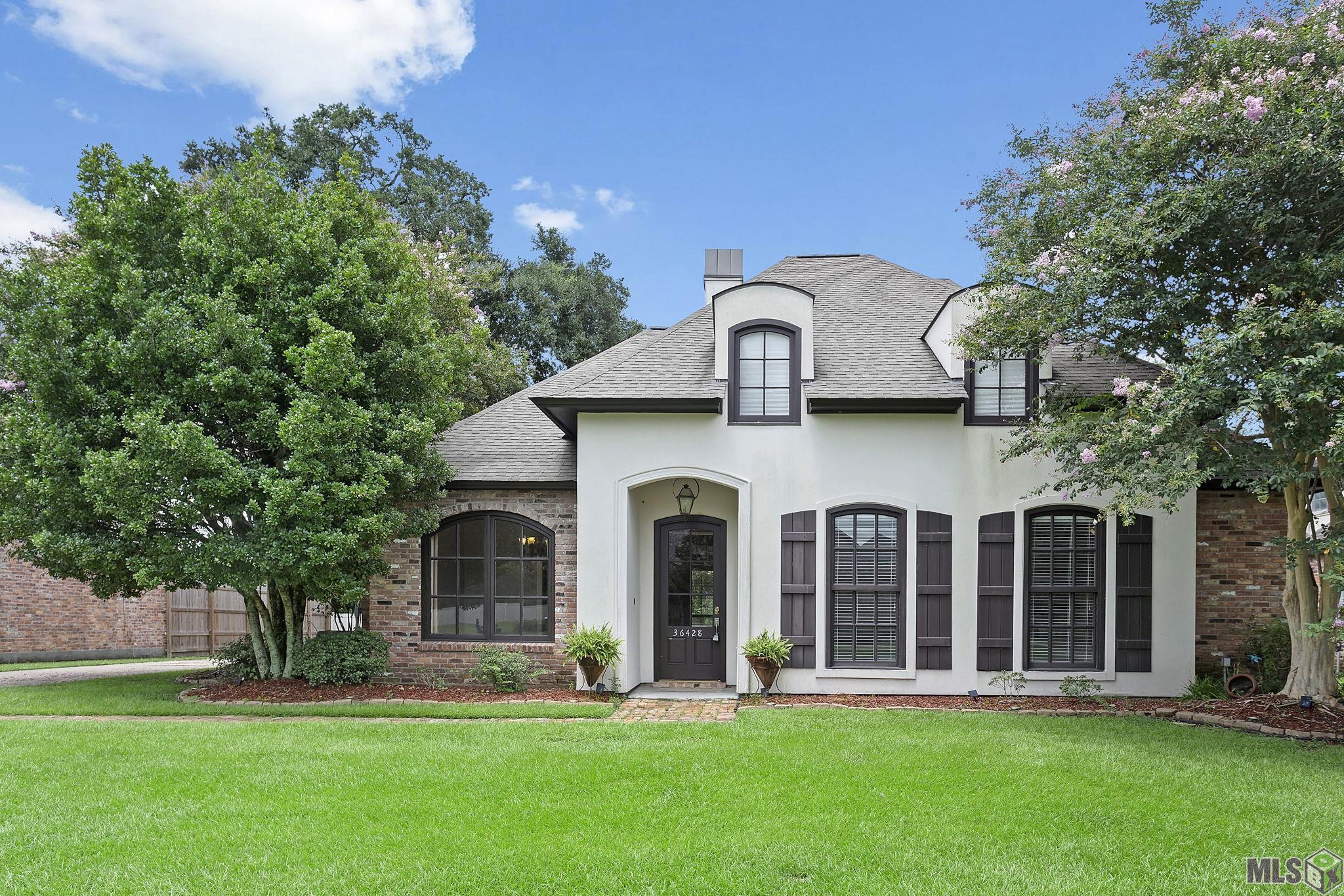 Attention Bargain Shoppers! This stunning custom 4-bedroom, 2 full bath, 2 half bath home with an office and bonus room is located in the gated LaMonte Subdivision off Bluff Rd and is a must-see! A large portion of the interior of the home was repainted in 2024 with "Ballet White," along with all baseboards. The home features wood floors in the living room and office, stained & scored concrete in the dining, kitchen, and breakfast areas, and luxury vinyl (installed in 2023) in all other bedrooms—NO carpet! The open-concept kitchen boasts granite countertops, a large breakfast bar, and stainless steel appliances (all under 3 years old, including the refrigerator). The master bath offers solid granite counters, double vanities, a jetted tub, a custom tile shower, and a large walk-in closet, while the hall/guest bathalso features slab granite counters. The main living area AC system was replaced in 2019 and a full-home generator installed in 2022. A NEW roof was added in 2017, and the bonus room upstairs and ½ bath were completed in 2021. The fully fenced backyard with a covered rear patio makes this home perfect for entertaining. Extras that stay include the kitchen island, all TV mounts, indoor & outdoor infrared security cameras, and the refrigerator! This home is move-in ready and located in an area with excellent schools. Deals like this are hard to find—schedule your private showing today!