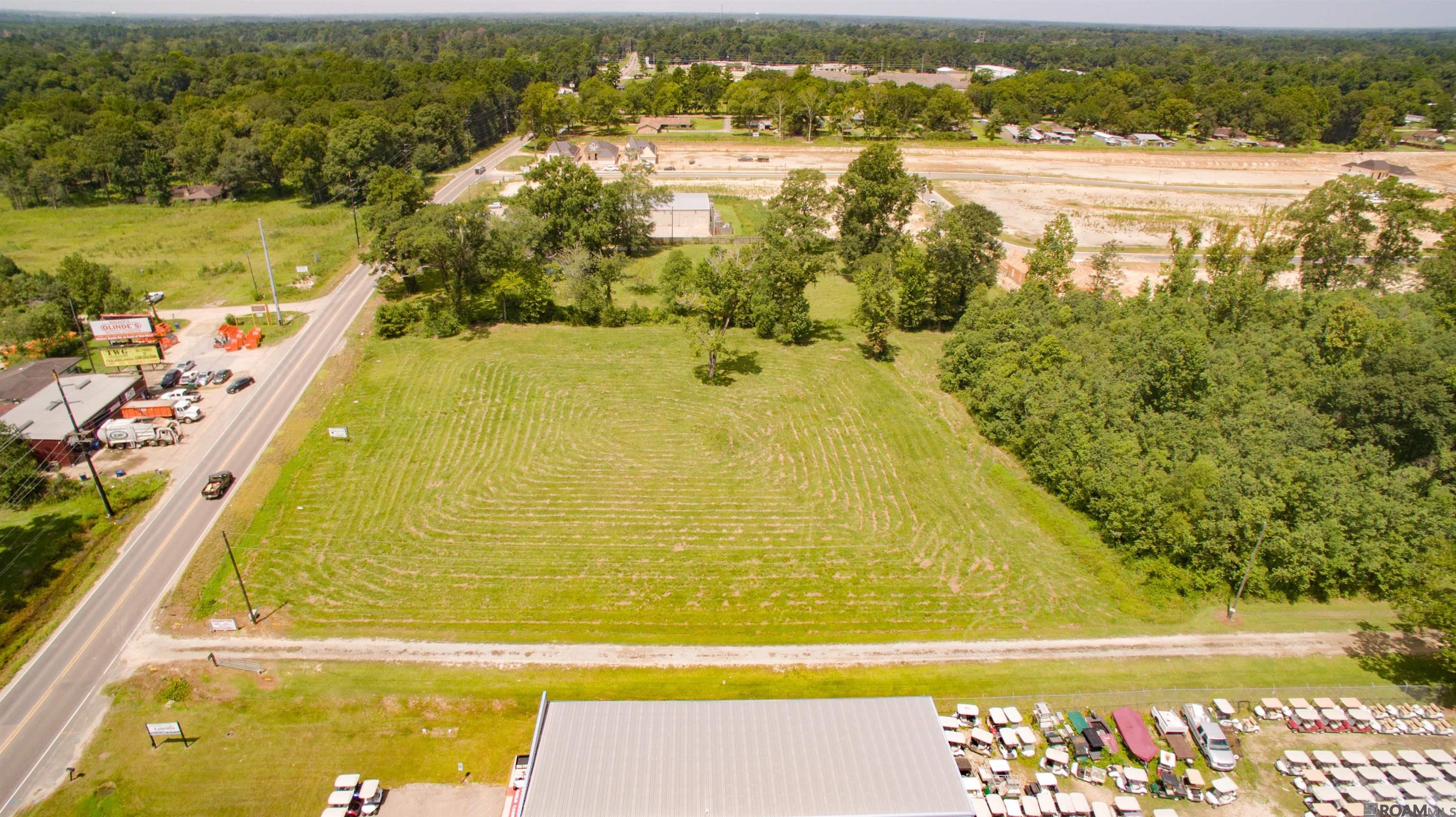Great location and great visibility, this property would be excellent for retail, light industrial, restaurant, and multi-family. Motivated seller will dsubdivide. 1.75 acre subdivided with survey adjacent to Dollar General. Home on property at no value.