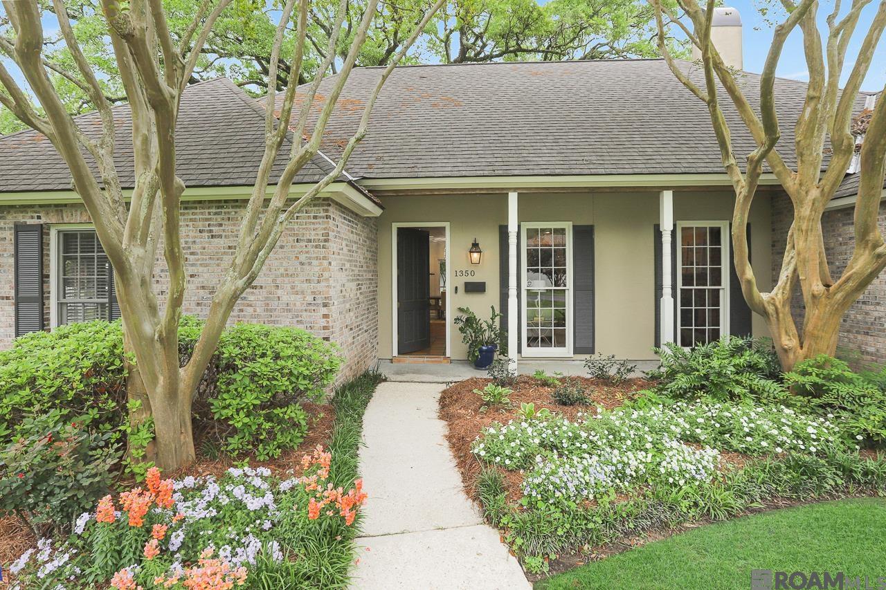 NOW EVEN MORE ATTRACTIVE: $32,000 PRICE REDUCTION. A quiet piece of paradise in the Heart of Southdowns!  A fabulous opportunity, a rare find with NO pier and beams! This home is built on a slab. Come and tour  everything this home has to offer...including a living room w/gas fireplace, open to the keeping & dining areas; plus a huge den area with pocket doors that open to a separate office space. The magical part of this home is a secret passageway leading to a private study. What a rarity!  The middle bookcase swings open (if you know the secret) into a whole separate room showcasing the gorgeous features of the oversized door and windows overlooking picturesque views of the backyard. The cabinets are solid cypress, and include lockable storage cabinets. The kitchen includes granite countertops, (Bourdeaux from MDS Stone), 5 burner Fisher & Paykel gas cooktop, special custom cabinets throughout with special pull out spice cabinets, double wall ovens (2021), Frigidaire Professional Refrigerator, farmhouse sink and a HUGE walk in pantry with an upright freezer. Also included are a large laundry area with a utility sink, yet another refrigerator, and a utility closet. The primary en-suite includes double vanities, jacuzzi tub, water closet and two walk-in closets. To say this home has storage.... wow! The private backyard is completely fenced and is covered with a beautiful canopy of a Historic Live Oak tree. There are two young fig trees, a young satsuma tree, a thornless blackberry vine, and two mature blueberry bushes.  Minutes from LSU, downtown Baton Rouge, close to retail, restaurants, 1-10 & 1-12, this location cannot be beat!