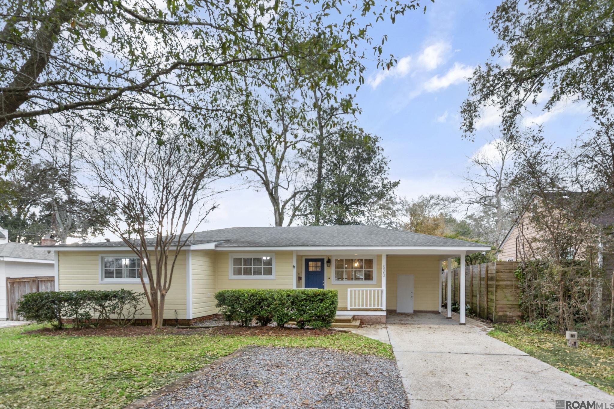 OPEN HOUSE SUNDAY, MAY 18TH 2-4PM! Must see in person to fully appreciate the potential! This charming cottage, located on a quiet dead-end street in University Hills, offers an incredibly versatile floor plan with the potential for rental income. The home includes an approx 563 Sq Ft apartment (included in the living area and added in the early 1990's) that can serve as a mother-in-law suite or rental unit.  The apartment features vaulted ceilings, skylights, a bedroom, full bathroom, kitchen, & living/dining area. This apartment has its own separate exterior entrance, yet it remains connected to the main house by a lockable door for added flexibility. It has been rented in the past for $1,300/month including all utilities. The entire home technically offers 5 bedrooms & 4 full bathrooms, including the apartment. The main home boasts an open floor plan with a spacious living area that is perfect for entertaining! Hardwood floors are found throughout most of the original portion of the home. Luxury Vinyl Plank floors are in the living room and office and ceramic tile everywhere else. There is no carpet in this home! The kitchen features granite counters, lots of counter space, a gas range with vent hood and ample cabinetry.The 3 bathrooms in the original part of the home were updated in 2018 with stone countertops, tiled shower surrounds & modern fixtures. Outdoor living is a highlight, with a large covered wraparound patio in the rear & a two-level deck at the front entrance. The rear living room offers beautiful views of the fully fenced backyard, shaded by mature trees. This home is just minutes from LSU, the LSU Lakes & fabulous dining options.  Both water heaters were replaced (2019 and 2021). Electrical panel for the original section of the home was replaced  in 2018. Home is now Vacant and move in ready!