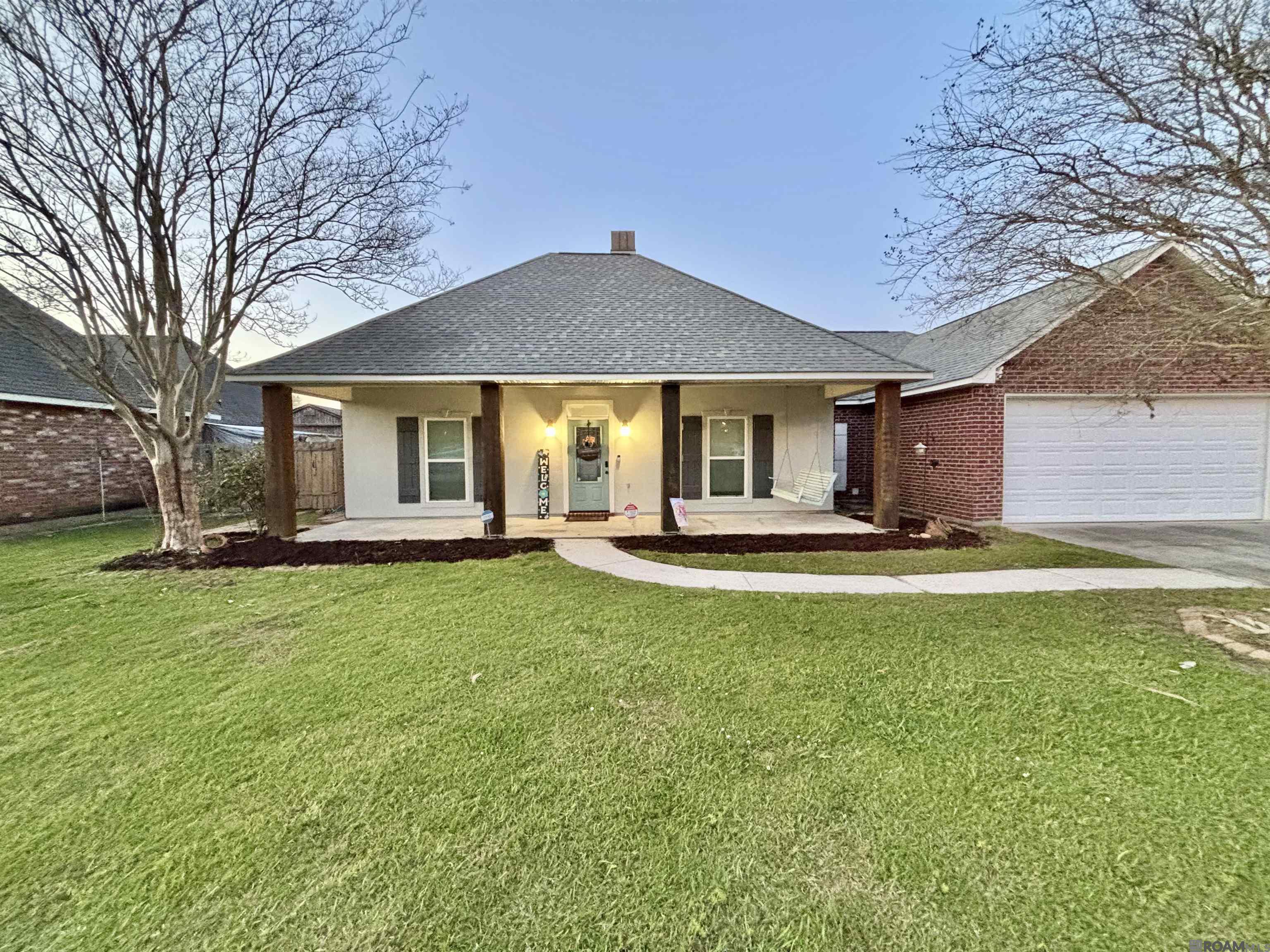 Lake Lot!! Located in the desirable Acadiana Place subdivision! This 3 bed/2 bath not only has a great view of the lake but has a HUGE backyard as well! The living room is spacious and offers a wood burning fireplace! As you make your way to the kitchen you will be blown away by the amount of cabinet space and how open the kitchen and dining area are! Not to mention the large window overlooking the lake! The kitchen cabinets are real oak! The bedrooms are a split floor plan with the master being privately located off the kitchen and the additional bedrooms are right off the living room. The master bedroom has an en-suite bathroom with a large soaking tub and separate job-built shower! The laundry room is located near the master and also has a walk-in pantry in there as well! When you make your way to the backyard you will see the great back patio area with lots of concrete space! It is a perfect spot for summer crawfish boils or just relaxing and enjoying the lake view!! There is also a neighborhood boat launch and pavilion area within walking distance!! This home has a LOMA on file with the parish!