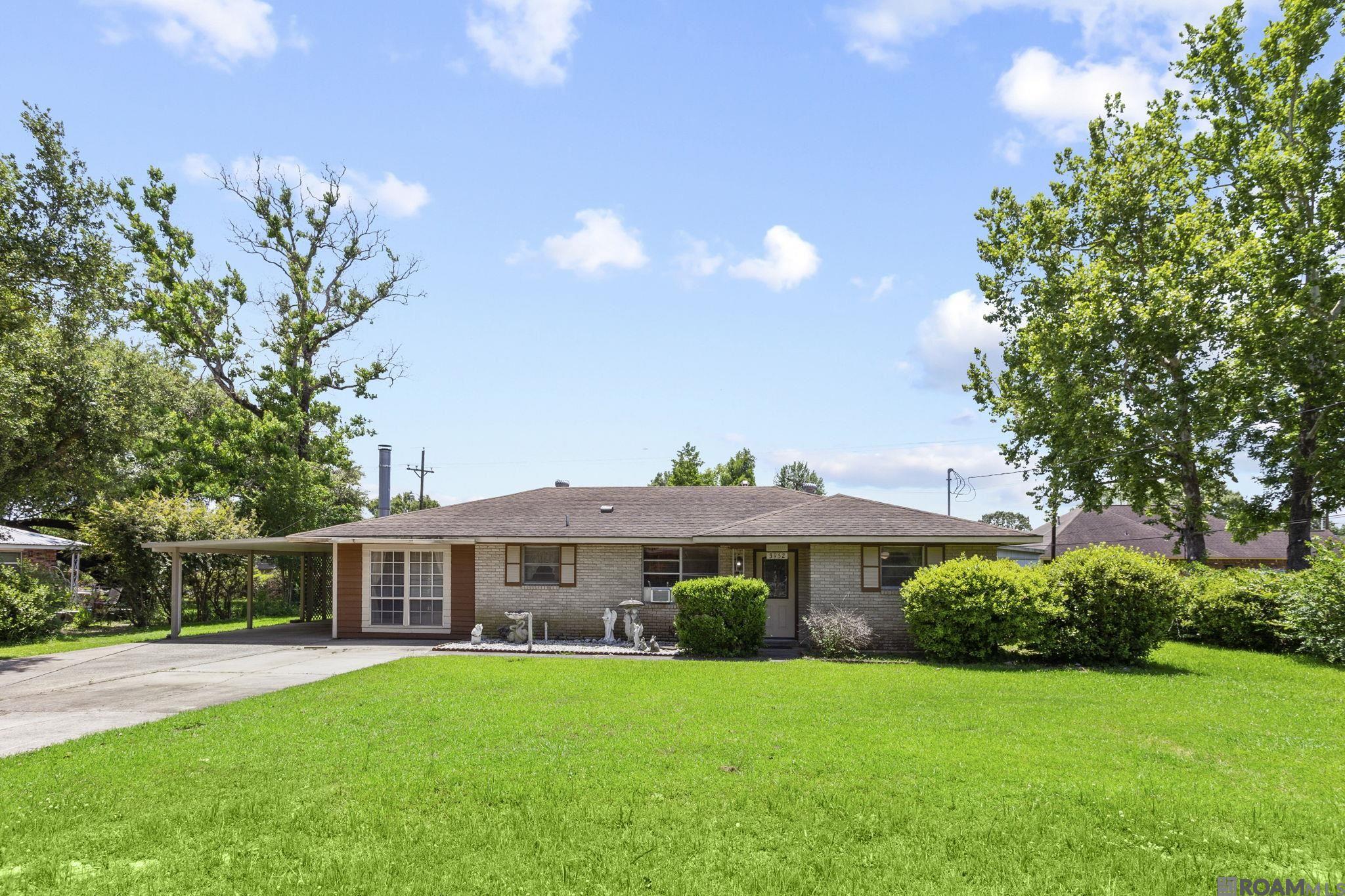 Well-kept 3-bedroom 2-bath home with a living room and a separate den space. The kitchen offers wood cabinets, nice counter space, a fridge to remain with the home, and is open to the dining area. the additional den area is off the kitchen and has a nice-sized laundry room off of it. All the bedrooms are on the right side of the home and all are nice sizes. This home has a nice covered patio area attached to the home and an additional large covered patio space (40x12) connected to the 320 sqft workshop. This home has a nice yard and is located in the heart of Zachary. Call to schedule a showing today