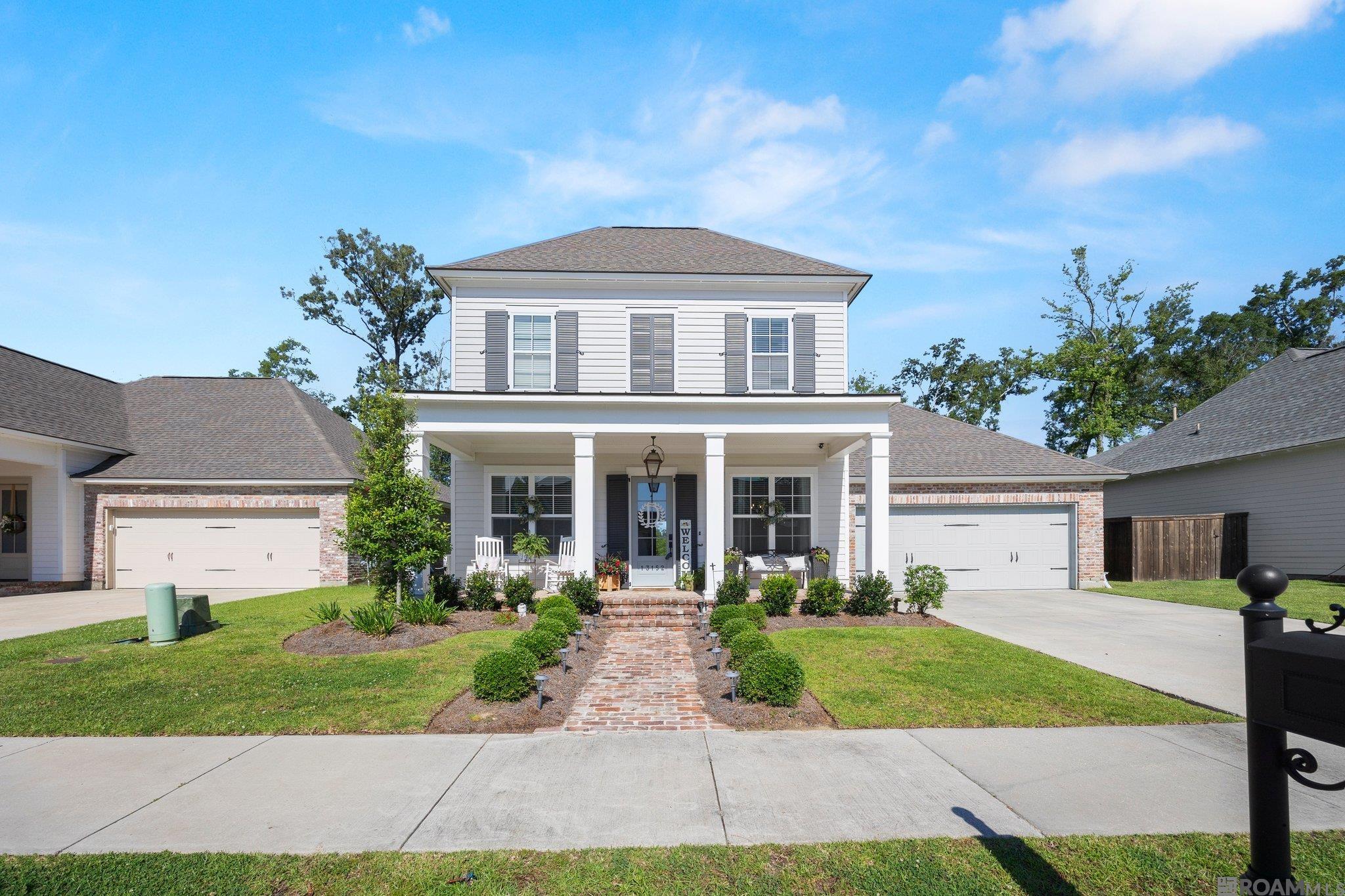 Nestled in the highly sought-after Central community, this charming two-story home in the Village of Magnolia Square perfectly blends comfort and convenience. Step inside and discover elegant wood flooring flowing throughout the main living areas. The heart of the home is a stunning kitchen, featuring a large center island perfect for gatherings, complemented by sleek quartz countertops. With four spacious bedrooms and three well-appointed bathrooms, there's plenty of room for everyone. An upstairs flex space offers versatility, ideal for a play area, home office, or media room. This residence is perfect for families and those who love to entertain. Enjoy the ease of a double garage and a nice covered patio, perfect for outdoor relaxation or al fresco dining on warm Louisiana evenings. Residents of Magnolia Square benefit from fantastic subdivision amenities, including playgrounds, a sparkling pool, and beautifully landscaped common areas. Location couldn't be better! You'll find yourself within easy walking distance of popular establishments such as Stab's Steak and Seafood Central, Beau Ideal Salon, Magnolia Square Spa and Wellness Suites, and a variety of other businesses catering to your everyday needs. Families will appreciate the convenience of being zoned for Central schools. Peace of mind comes standard with this home: it's located in Flood Zone X and has never flooded. Don't miss the opportunity to make this wonderful house your new home!  Ready to experience the charm and convenience of Magnolia Square living?