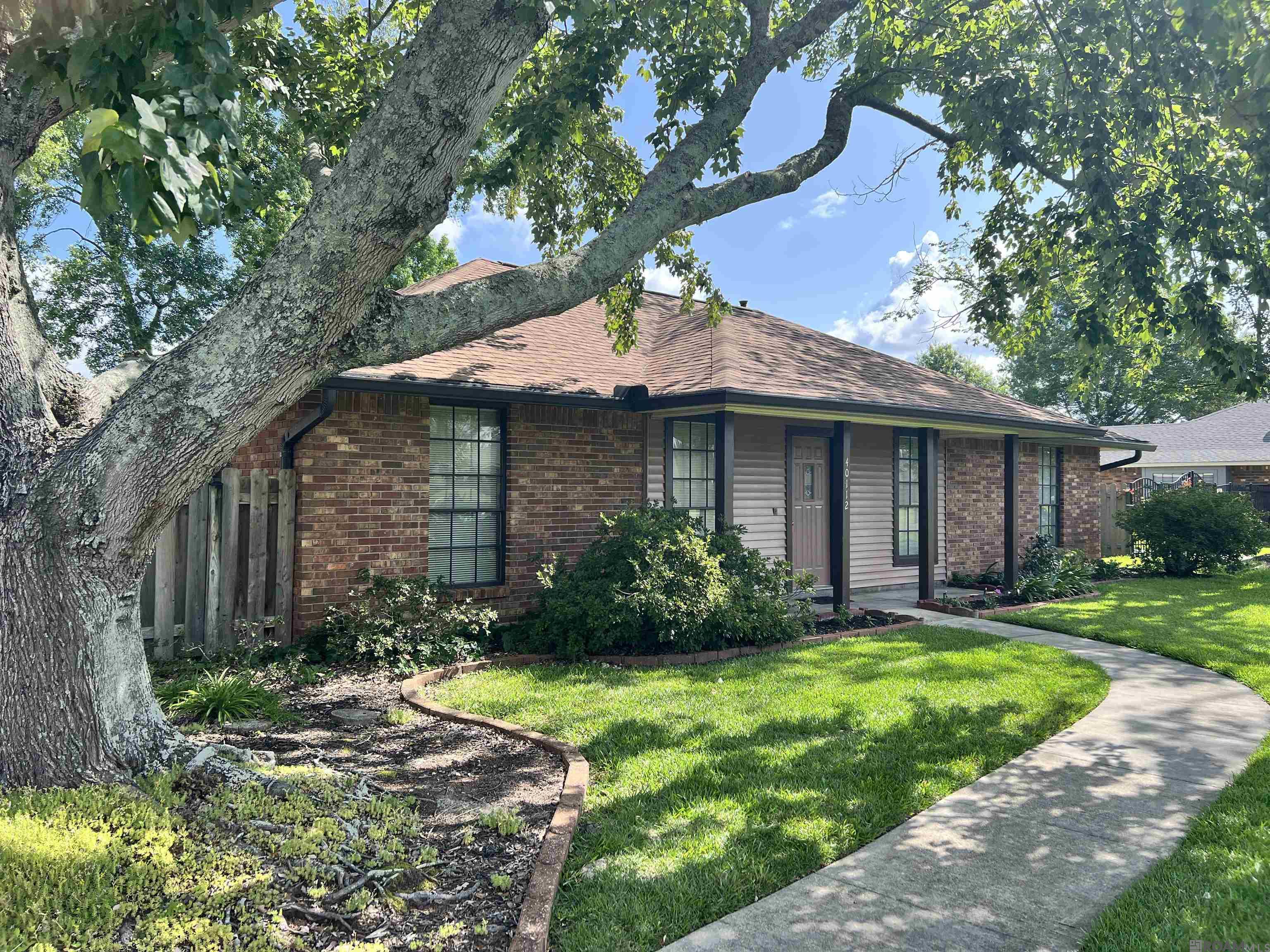 Beautifully updated 4 bedroom, 2 bath home on a ½-acre landscaped lot with a new roof (2024), rain gutters, privacy fence, and HVAC system replaced in 2018. This move-in ready home features ceramic tile and luxury vinyl plank flooring, updated fixtures, ceiling fans, and blinds throughout. The kitchen boasts quartz countertops, custom cabinets, and comes fully equipped with all appliances—including a microwave, glass-top electric stove, dishwasher, and refrigerator. The spacious primary suite includes a large closet with built-in shelving and drawers. Exterior features include two 2-car carports, a 6'x20' climate-controlled storage room, 8'x9' storage shed, open patio, whole-home generator, and a 14'x16' workshop with mini-split A/C, vacuum and ventilation systems, locking toolboxes, and loft with ladder access. This home offers the perfect blend of comfort, style, and functionality!