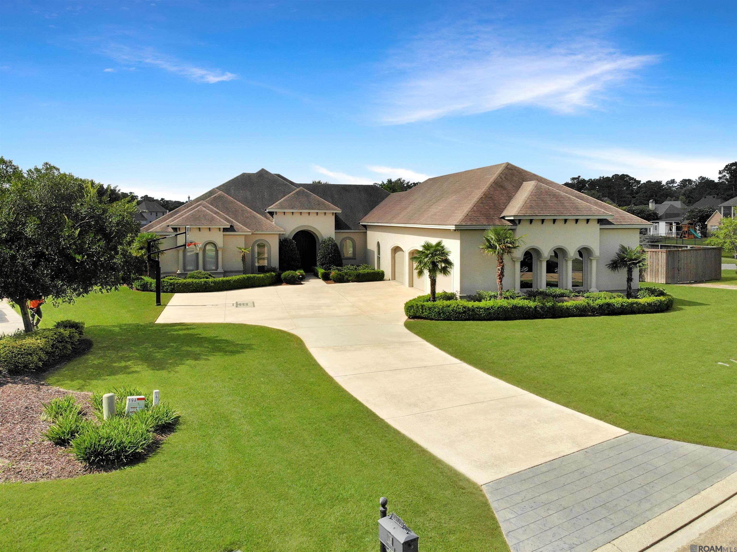Step into elevated luxury with this breathtaking, custom-designed 5-bedroom, 4 full bath, 2 half bath estate that truly has it all. Every detail of this expansive home was thoughtfully curated to combine comfort, sophistication, and functionality. The gourmet kitchen is a chef’s dream, complete with an oversized walk-in pantry and seamless flow into the open living areas—perfect for entertaining. A private office and dedicated billiard room offer the ideal balance of productivity and play, while the fully-equipped bar and 12-seat home theater bring your hosting dreams to life. Throughout the home, you’ll find rich marble and wood flooring, custom closets and drapes in every room, and a Control4 smart home system for seamless automation. An elevator offers convenient access across all levels, while energy-efficient spray foam insulation and a massive walk-in attic provide long-term comfort and storage. Outside, the resort-style pool with heating and chilling system is surrounded by an elegant travertine deck and lush, professionally landscaped grounds, complete with a full irrigation system. An oversized 3-car garage accommodates full-size trucks with ease, and a powerful 30KW generator ensures peace of mind year-round. High-end wood/clad windows finish off this masterpiece, delivering beauty, durability, and efficiency. Luxury, function, and unmatched amenities—this is the home you’ve been waiting for. *Structure square footage nor lot dimensions warranted by Realtor.