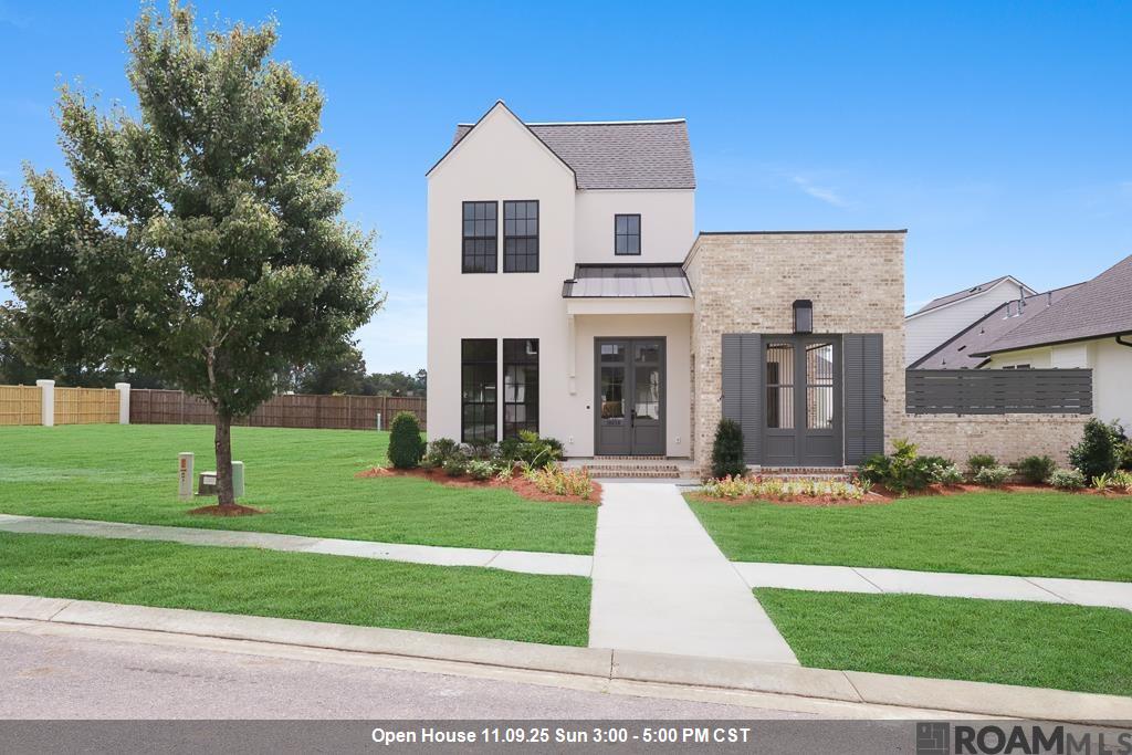 Minutes from Baton Rouge's Highland Rd. & in New Prairieville High School District, 2-Story, w/ Separate Office, 3-Beds, 2½-Baths & Outdoor Kitchen! Open floor plan seamlessly connects the living areas, offering incredible details & amenities, including Guest Powder Room & fireplace w/Custom Mantle. Fully equipped outdoor kit w/unique custom-built fire pit, remote-controlled screen & folding patio door, creating additional living space opening directly into the home. w/ Perfect Side Yd Space for a Pool! Inside, chef’s kit features SS appliances, gas cooktop, Stone counters & massive island w/seating. Butler’s pantry boasts, custom-built cabinets & stone countertops. Primary bath offers a spa-like retreat w/freestanding tub, full glass enclosed custom-tiled shower & roomy closet w/built-ins. Upstairs, 2 bedrooms w/shared bath & 10 X 17 Flex Space. Top Rated Ascension Parish Schools completes the package . . .