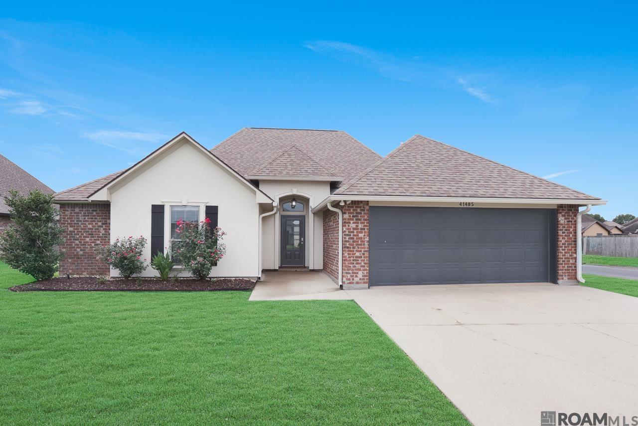 Welcome to this beautifully maintained 3-bedroom, 2.5-bath home situated on a spacious corner lot in one of Prairieville’s most sought-after areas. With over 2,000 square feet of living space, this home offers comfort, functionality, and style in every detail. Inside, you’ll find wood floors in the living room, an open-concept layout, and a flex space perfect for a small home office, toy room, or mudroom area. The huge kitchen is a standout feature—complete with a gas stove, stainless steel appliances, and extensive counter and cabinet space ideal for cooking and entertaining. Primary suite has tons of natural light, en suite bath with soaking tub, separate shower and a walk in closet that has been updated with built in shelving and storage.  Two spacious guest rooms share a jack and jill bath.  Half bath conveniently located off of the kitchen.  Step outside to a large, fully covered patio addition, perfect for relaxing or hosting guests. The backyard is enclosed with a privacy wood fence and double gate, offering space for pets, play, or additional storage. This home is located in Flood Zone X and has never flooded, providing peace of mind for homeowners. It’s also zoned for top-rated schools, including the new Prairieville High School. Don’t miss this well-kept gem in a prime location—schedule your private showing today!