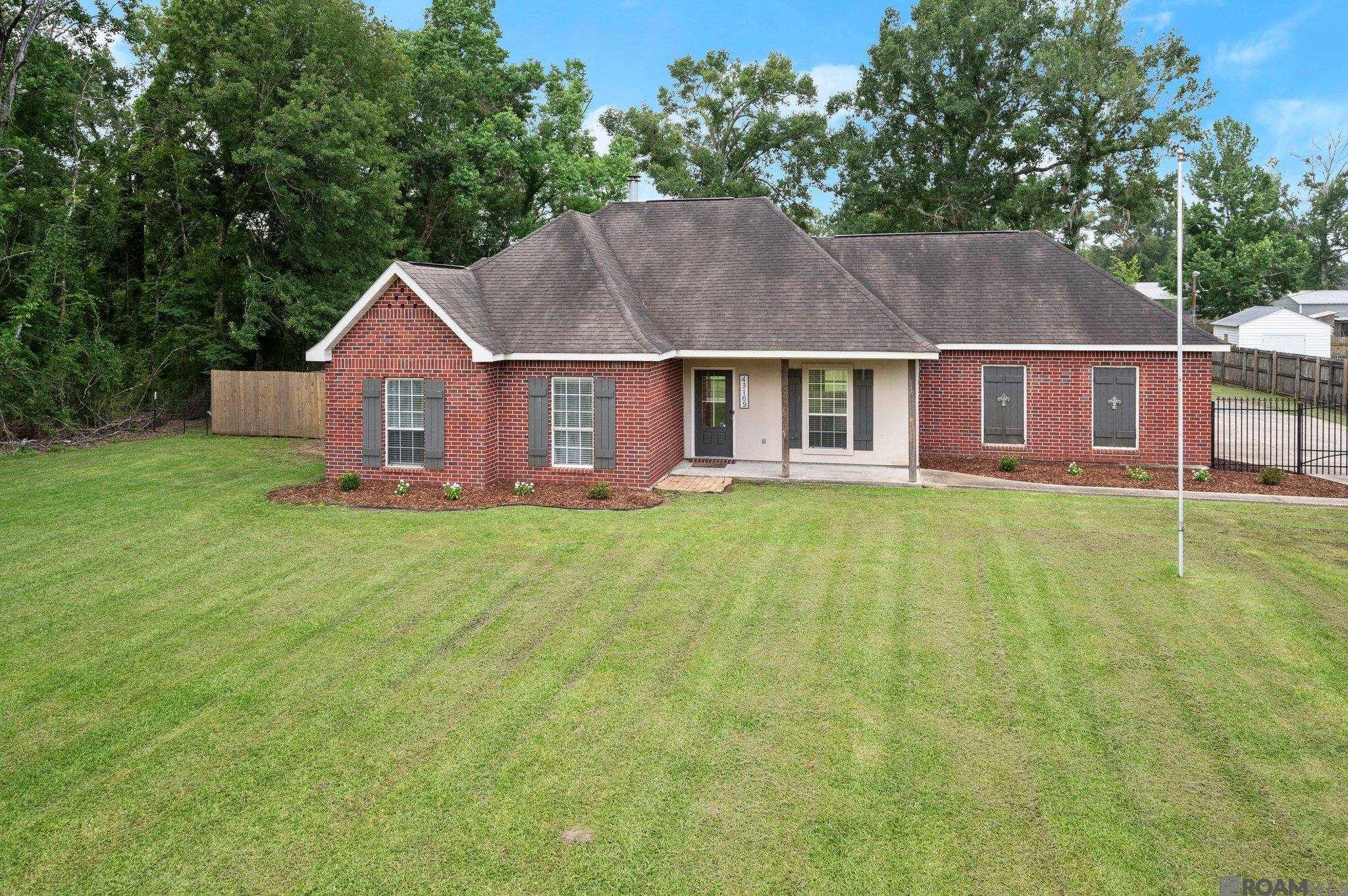 Welcome to this beautifully maintained 3-bedroom, 2-bath home nestled on a spacious 0.5-acre lot in the heart of Ascension Parish. Featuring an inviting open floorplan with no carpet throughout, this home is as functional as it is stylish. The large kitchen island is perfect for entertaining or family gatherings, while the open living and dining areas create a warm and welcoming atmosphere. Step outside to enjoy not one, but two covered patios, ideal for outdoor dining or relaxing in the shade. The fully fenced backyard offers privacy and plenty of room to play, garden, or add a pool. You'll also appreciate the rear carport with ample parking and storage space. Located in a peaceful area with no HOA, this property offers freedom and flexibility—plus the benefit of plenty of room to grow. Whether you're looking for your first home or your forever home, this one checks all the boxes!