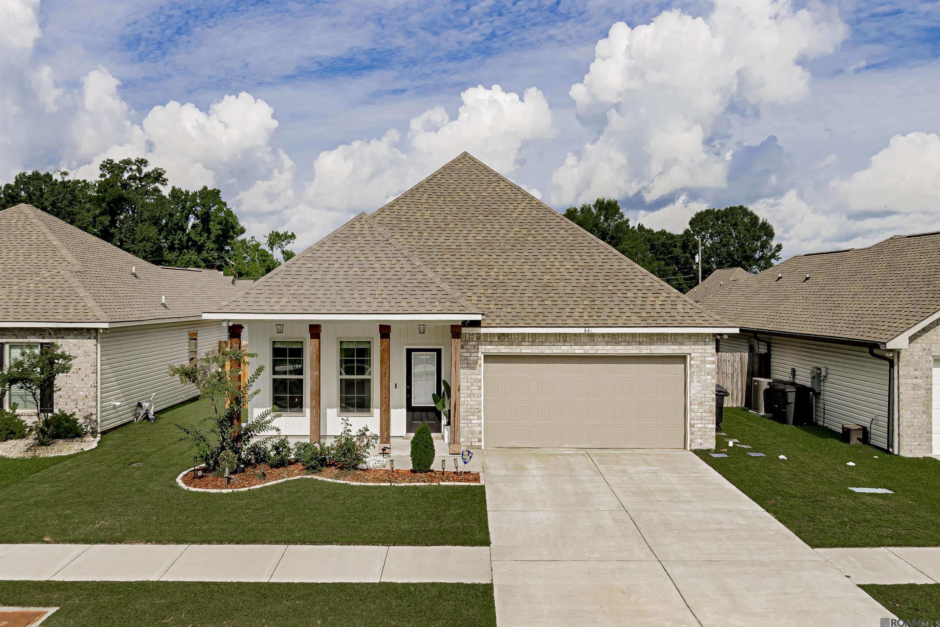 Are you looking for a 4 bed/2 bath home conveniently located in Gonzales that’s LESS than 4 years old? Keep reading! This is one of the most charming homes you’ll see in all of Ascension parish and has SO much to offer for this price! The peaceful living areas, beautiful color schemes, and amazing backyard is one that has to be seen in person to truly appreciate. Driving up to the home you’ll notice a great front elevation with 4 wood beams, fresh landscaping, and a 4 year old architectural shingled roof! Upon entering the front door you’re greeted by new luxury vinyl plank flooring, extra recessed lighting throughout, a sleek custom fan in the living room, and a custom light fixture above the dining table. This home offers a large open concept so the chef in the kitchen can converse with the guests in the living room! The kitchen features a large granite island, a separate movable butler's bar that makes a great coffee bar, and a pantry room. The spacious primary suite also features the luxury vinyl plank flooring and has a great view of the back yard. The primary bathroom has a separate walk in shower, a soaking tub. The large, fenced in backyard offers several entertaining areas such as a gazebo style canopy deck, an additional lounge deck with pergola cover, and lastly a shaded back patio before walking on the uninterrupted green space! This is one of the largest homes in the Waters Cove neighborhood at 1,835 Sqft. It has never flooded and is in flood zone X, so no flood insurance required! Schedule your showing today!