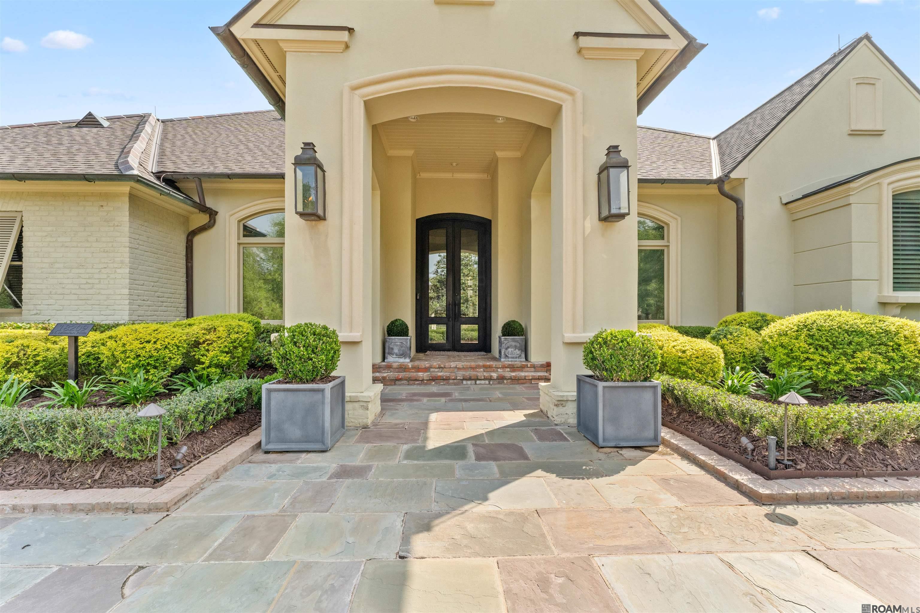 Welcome to this extraordinary and meticulously maintained residence nestled within the esteemed Country Club of Louisiana. Prepare to be captivated by the unparalleled attention to detail and impeccable design that sets this home apart from the rest. With a sprawling living area spanning an impressive 7,492 square feet, this residence offers a truly luxurious lifestyle. Step inside the grand foyer, where exquisite craftsmanship greets you at every turn, creating an ambiance of refined elegance. The abundance of natural light that fills the living spaces creates an inviting and warm atmosphere, perfect for both relaxation and entertaining. Indulge your inner chef in the gourmet kitchen, meticulously designed and equipped with top-of-the-line appliances. Whether you're hosting intimate gatherings or grand celebrations, this culinary haven is sure to exceed your expectations. Retreat to the master suite, a private oasis that exudes tranquility and sophistication. The en suite bathroom offers a lavish sanctuary, complete with luxurious finishes and a spacious walk-in closet, ensuring your comfort and convenience. Each additional bedroom within this remarkable home has been thoughtfully designed with its own unique charm, providing a personal haven for family members or guests. Step outside into the meticulously landscaped outdoor space, where an inground pool, hot tub, gazebo and fully equipped outdoor kitchen await. This oasis is a haven for relaxation and entertainment, offering endless opportunities to create lasting memories. Conveniently located near a plethora of amenities, including shopping, dining and entertainment options, this residence offers the perfect balance of privacy and accessibility. Immerse yourself in the unparalleled beauty and sophistication of this exceptional property within this exclusive gate community. Don't miss the opportunity to call this meticulously cared-for residence your own.