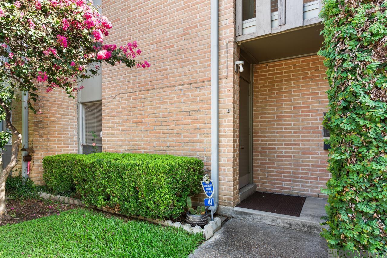 Originally a 1 Bedroom, professionally converted to a 2 Bedroom. Nice first level condo at the LSU lakes, just minutes from campus. Located in the gated community, Lake Crest Condos, assigned covered parking and fenced in rear patio/yard. No carpet! Cute Kitchen, tiled floors, dishwasher, newer refrigerator remains. Ceiling fans in Bedrooms. Great colors throughout! Cutest vintage mailbox. HOA fees include pool care, pest control/termite contract, water, sewerage, garbage, repairs to exterior, lawn care and professional management. Call today to schedule a private showing!