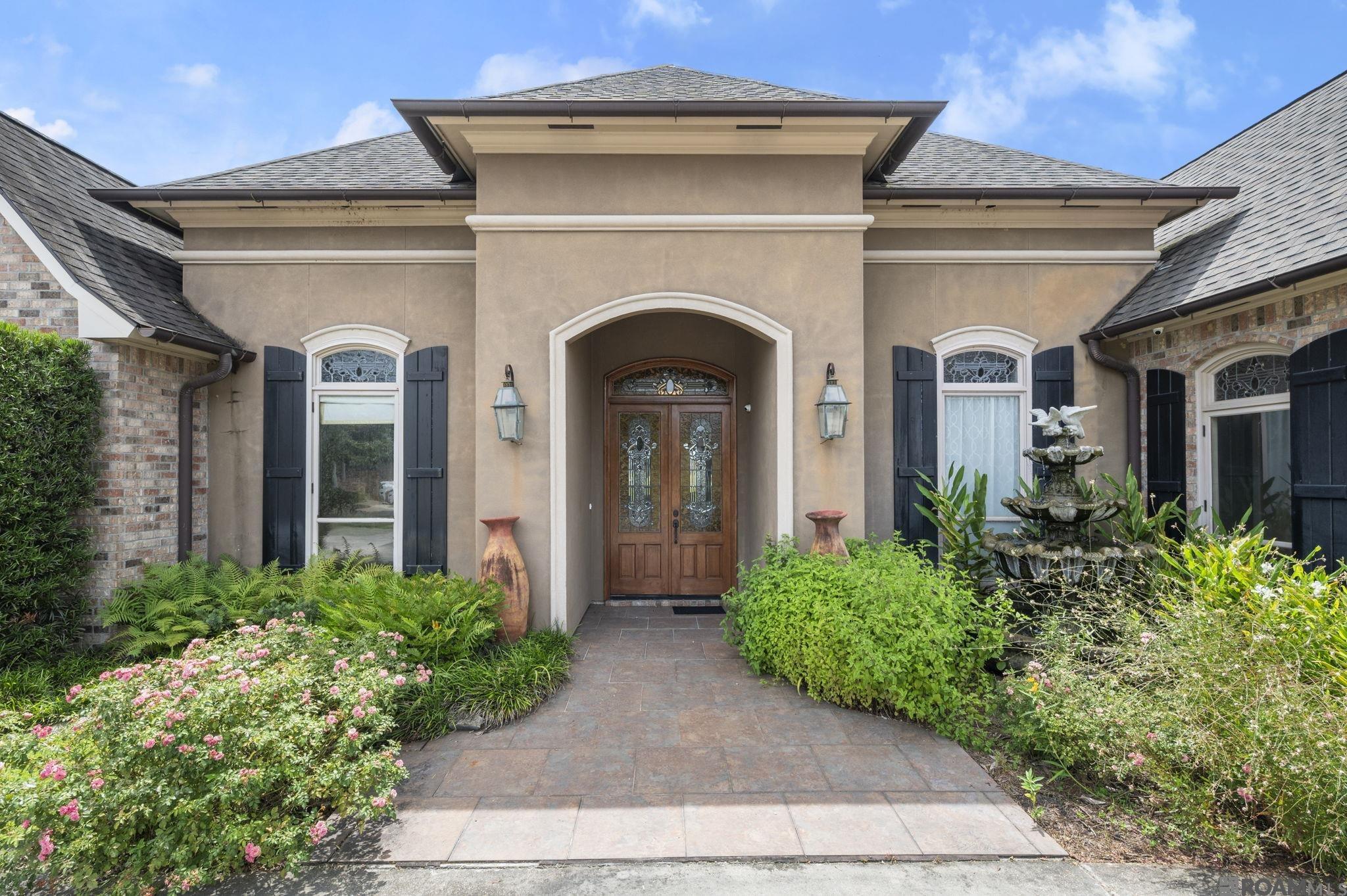 This beautiful and well-appointed home in the desired Bellingrath Lakes Subdivision is now available!  This home has all the upgrades and features you could ask for - a huge family room all open to the kitchen and breakfast room.  The sunroom off the breakfast room is a nice quiet area for reading or just relaxing.  Walking back through the large custom kitchen there are lots of counterspace with granite, 2 separate sinks, a large walk-in pantry and cypress cabinets.  The back hallway going towards the garage includes a bedroom and full bathroom.  With a triple split floor plan, the primary bedroom and bathroom are off the family room down a small hallway, with the laundry room conveniently located off that hallway.  Combining the primary bedroom and bathroom, you have the perfect retreat including a jetted tub and huge custom walk-in closet.  There are 2 more bedrooms off the family room in the front of the home with a full bath.  One of the bedrooms would make the perfect home office or library with custom bookshelves on 1 wall.  Other features:  whole home generator, has never flooded and in Flood Zone X, waterfront lot that is 3/4 of an acre with a deck in back yard and open attic storage above the garage accessible by stairs. Central Schools!