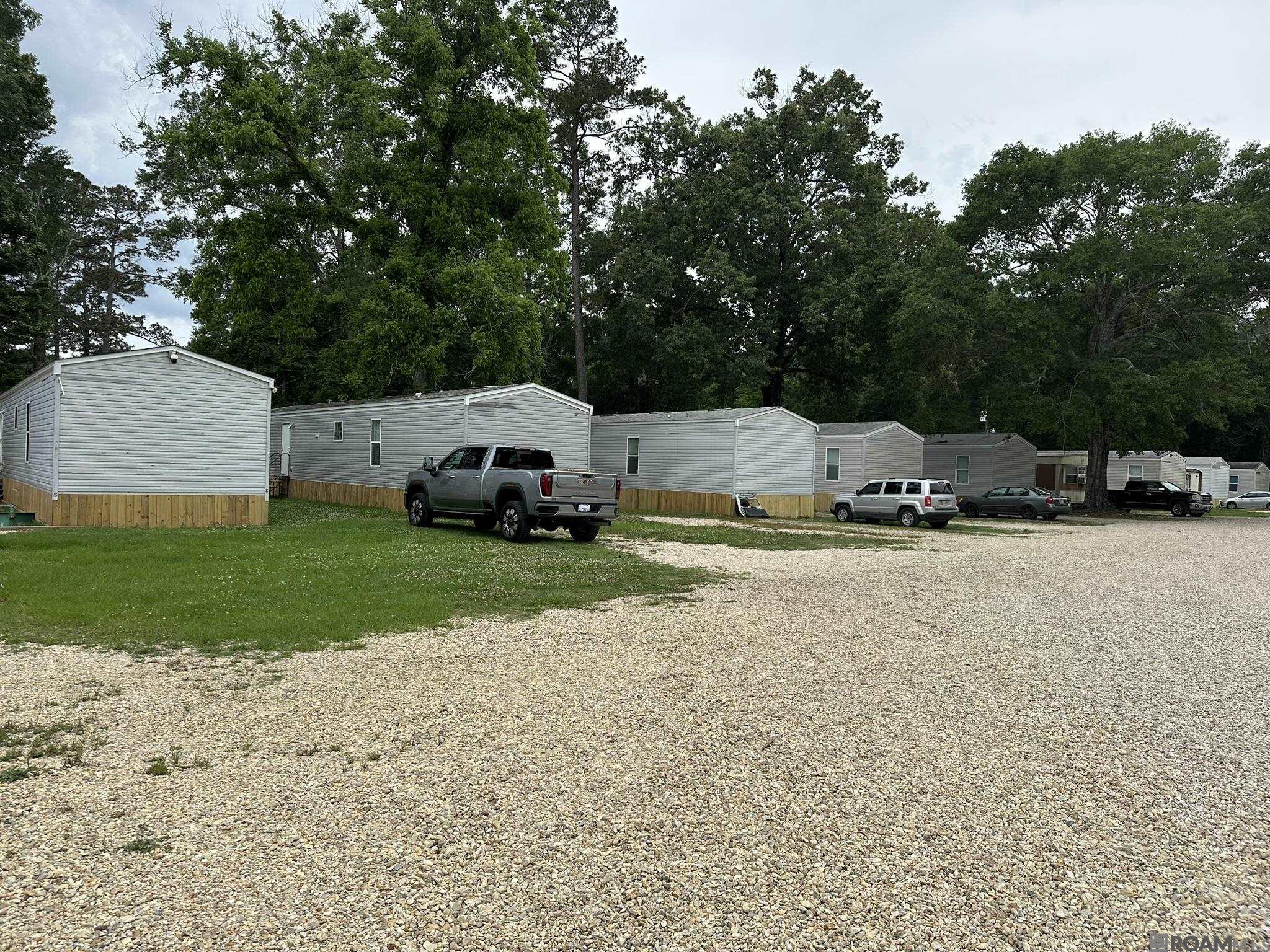 Exceptional investment opportunity — Mobile Home Park with 18 park-owned units.  15 homes built in 2017 or later — each leased at $1,300/month.  3 older models — each leased at $600+/-/month.  Consistently maintains 100% occupancy.  Owner pays water & sewer; tenants pay electricity.  Located in Flood Zone X (low flood risk).  10.2% CAP Rate.  2 Acres.  18 Units.  Well-Maintained Property.  Expansion potential on adjacent property.  Strong performer with a 10.2% CAP rate and $254,950 gross annual income.