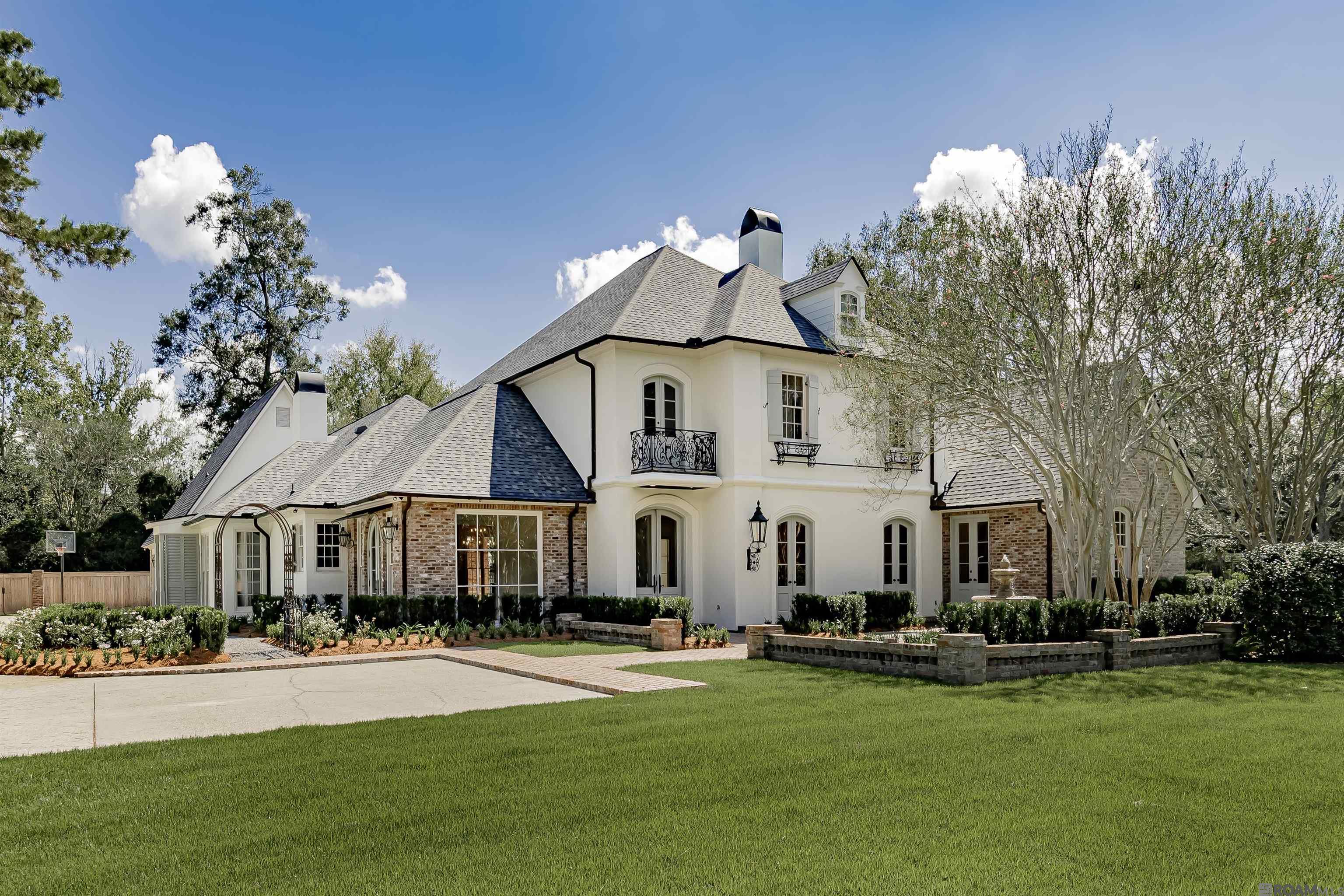 Renovated and ready! Nestled on a prime street in CCLA, this 5 bedroom, 5 bath home with media room and 3-car garage is move-in ready. With interiors designed by Anne McCanless, you'll find updated luxurious materials including quartzite and marble countertops, designer light fixtures and custom cabinetry combined with classic elements of antique cypress beams, antique brick and three fireplaces.   The spacious floor plan features a new kitchen and bar layout with GE Monogram appliance package including a 48" gas range, Sub-Zero wine column, Miele dishwasher and GE cocktail ice maker. Also featured is an adjacent keeping area with fireplace and informal dining area. The primary bedroom and bathroom, and two additional bedrooms each with baths are located downstairs. Upstairs, two large bedrooms and baths are separated by a large living/game room. A separate media room is located over the garage. This home features a 48KW Kohler whole-home generator, roof replaced in 2024, revitalized front and rear courtyards and custom landscaping with irrigation for the entire property.   Residents of CCLA enjoy access to a championship golf course, pool, tennis courts, club house, fitness center and event spaces. This is your opportunity to own a completely updated home in this covetable neighborhood!