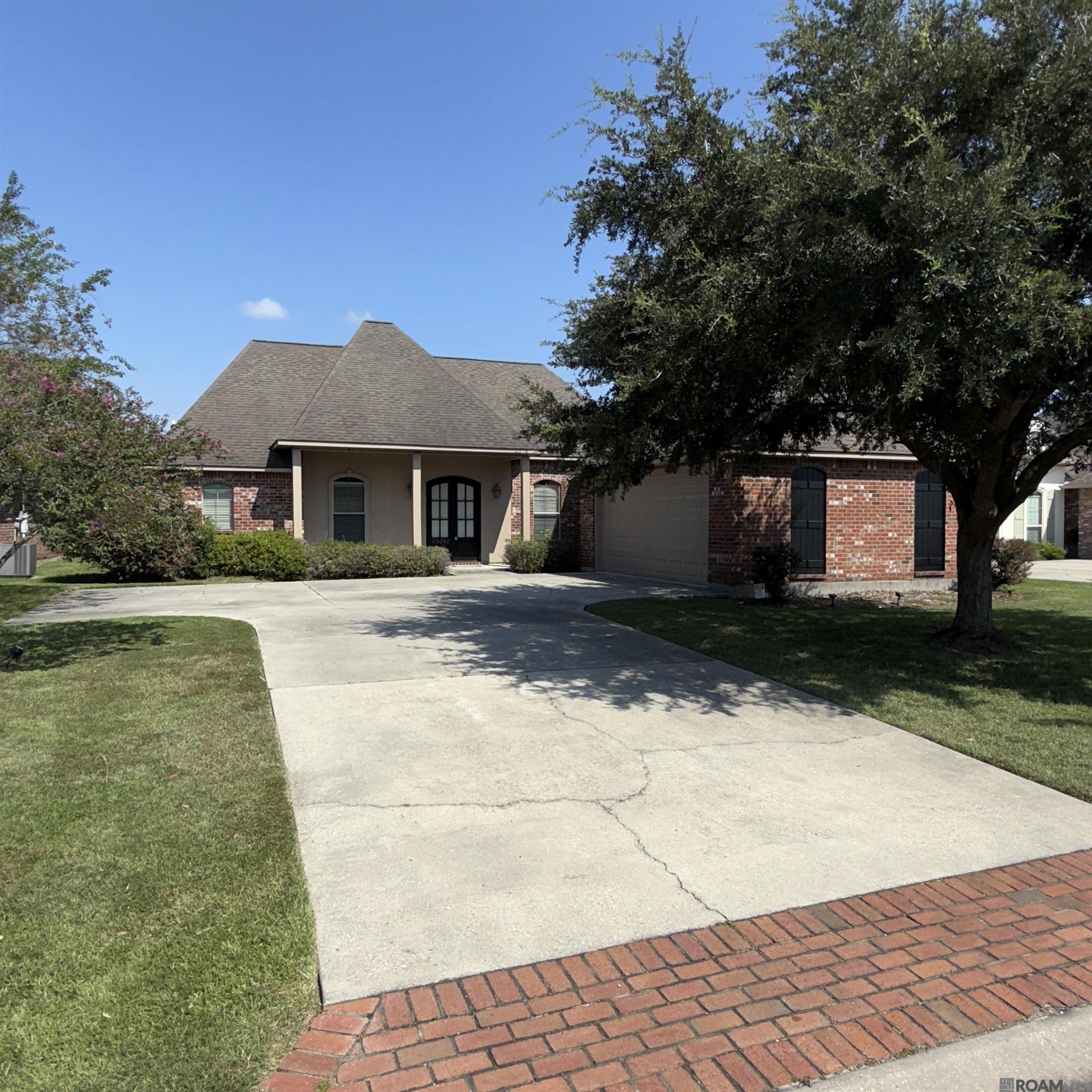 Awesome location! ** Convenient to Baton Rouge, I-10 and New Orleans * * Custom built with all the bells and whistles * 4 bedrooms and 3 Baths * Grand Entrance with Beveled Edge Low E Glass Double Front Doors * Foyer, Formal Dining and Living Rooms with 5 Inch Wide Oak Plank Floors * Ventless Gas Fireplace * Decorative Mantle w/ Columns * Chef's Kitchen Features: Stainless Steel Appliances, Gas Cook Top, Stained Raised Panel Cabinets, Solid Granite Island with Bar, Tumbled Travertine Backsplash w/ Granite Insets, Spacious Pantry, and Breakfast Area * Hollywood Bathroom with 2 Separate Vanities * Cast Iron Tubs w/ Simulated Marble Surround * Master Suite with Raised Ceiling, Special Bath has Separate Job Built Shower w/ Seat, Jetted Tub, Granite, Master Closet Built-ins , Beveled Edge Trimmed Mirrors, Ladies Vanity * Laundry Room w/ Cabinets, Sink and Counter Space * *Designer Light Fixtures and Recessed Lighting Throughout ** Crown Moldings in Every Room** Wood Wrapped Windows ** Covered Rear Porch **Outside Lighting ** Landscaped * * All the Amenities You Expect In A Custom Built Home! **