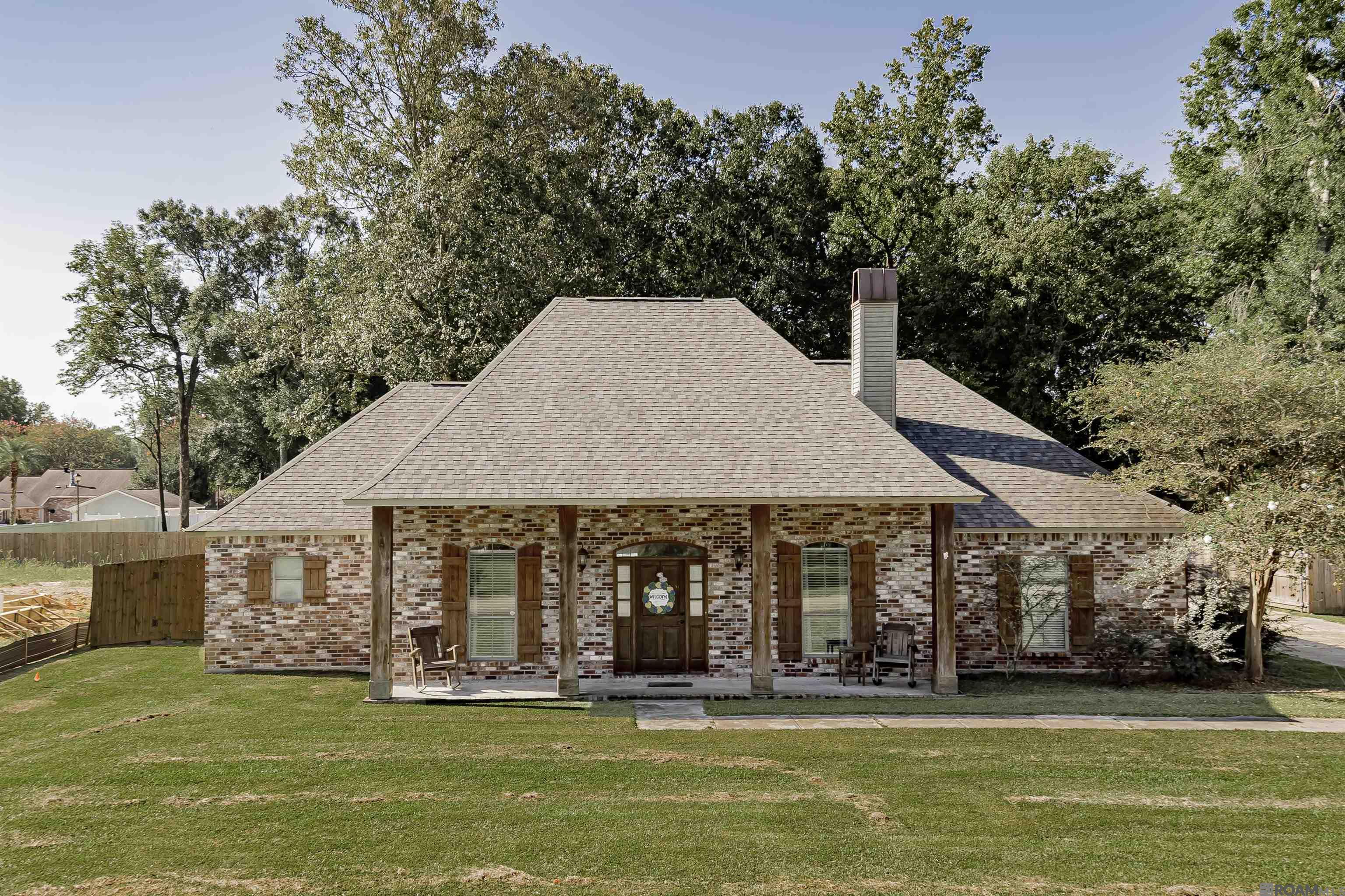 This home is a rare find in the highly desirable Plantation Way subdivision in the Central Community School District. It's a custom-built 3-bedroom, 2.5 bath home with 2023 square feet. It features tile and wood floors throughout, solid cypress kitchen cabinets, ample storage, oversized closets, and a beautiful brick fireplace with cypress built-ins. It also features a huge backyard with a concrete patio and island. It has a two-car carport, as well as a two-car garage, so there is plenty of room for the grocery getter and the toys. The house is located on the back street of a wonderful neighborhood, so it's a great spot for children with no through traffic and lots of families on the street. It has updated lighting, paint, and an architectural shingle roof. You will love the way this house is laid out and flows. It really is a must-see. It is ready for you to move in and make it your home. The home did not flood in 2016. Flood zone X. Schedule your showing today before it's gone.