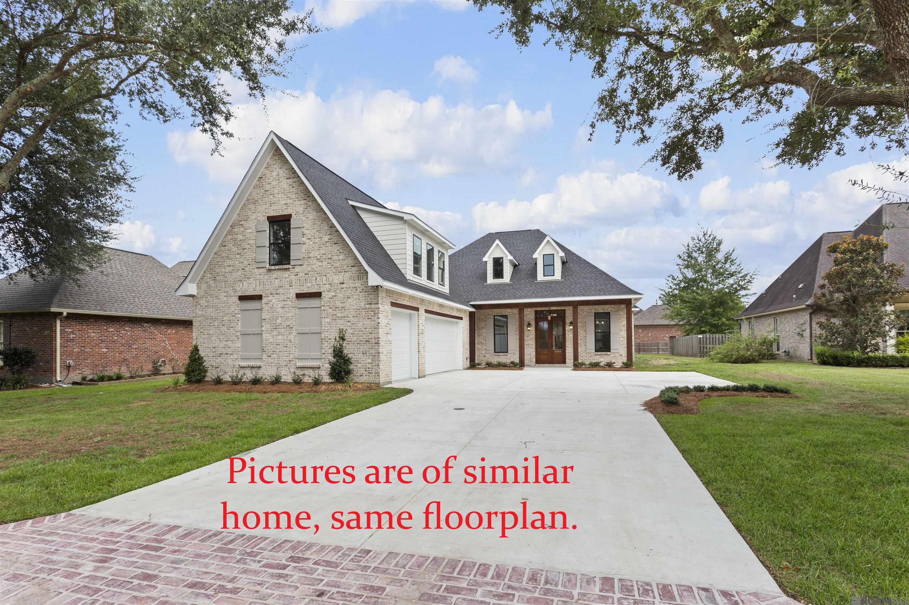 On the Golf Course!! This stunning new "under construction" 5-bedroom, 3-bath home is a true showstopper, blending timeless elegance with modern luxury. Pictures are of similar home - same floorplan. Step inside to soaring ceilings, oversized cove crown molding, and gorgeous hardwood floors that flow seamlessly throughout—no carpet anywhere. The wide-open floorplan showcases a chef’s kitchen with custom cabinets to the ceiling, striking 3 cm slab quartz or granite counters, farmhouse sink, wine fridge, undercabinet lighting, custom backsplash, pot filler, oversized island, and a walk-in pantry. A stunning exposed beam defines the open concept, creating a breathtaking transition from the kitchen to the living area, where a cozy gas log fireplace becomes the perfect focal point. The luxurious primary suite is a retreat of its own, featuring two spacious walk-in closets with built-ins and a spa-like bath complete with a free-standing tub, large custom-tiled shower, dual vanities, private water closet, and abundant storage. Two primary closets, both walk-ins and both with built in chest of drawers and shelving. Laundry room is also spacious and has a sink. Three additional bedrooms and a beautifully appointed hall bath with double vanities and custom tile surround and a mudroom area complete the first floor. Upstairs, discover a massive fifth bedroom with another full bathroom with tile surround and an oversized walk-in closet—perfect as a guest suite, media room, or home office. Step outside to enjoy the oversized back porch, designed for entertaining with a tongue-and-groove ceiling, a beautiful outdoor fireplace, and a fully equipped outdoor kitchen. Every inch of this home has been thoughtfully designed with high-end finishes and wow-factor details inside and out. Still time to personally select custom finishes for most of the home.